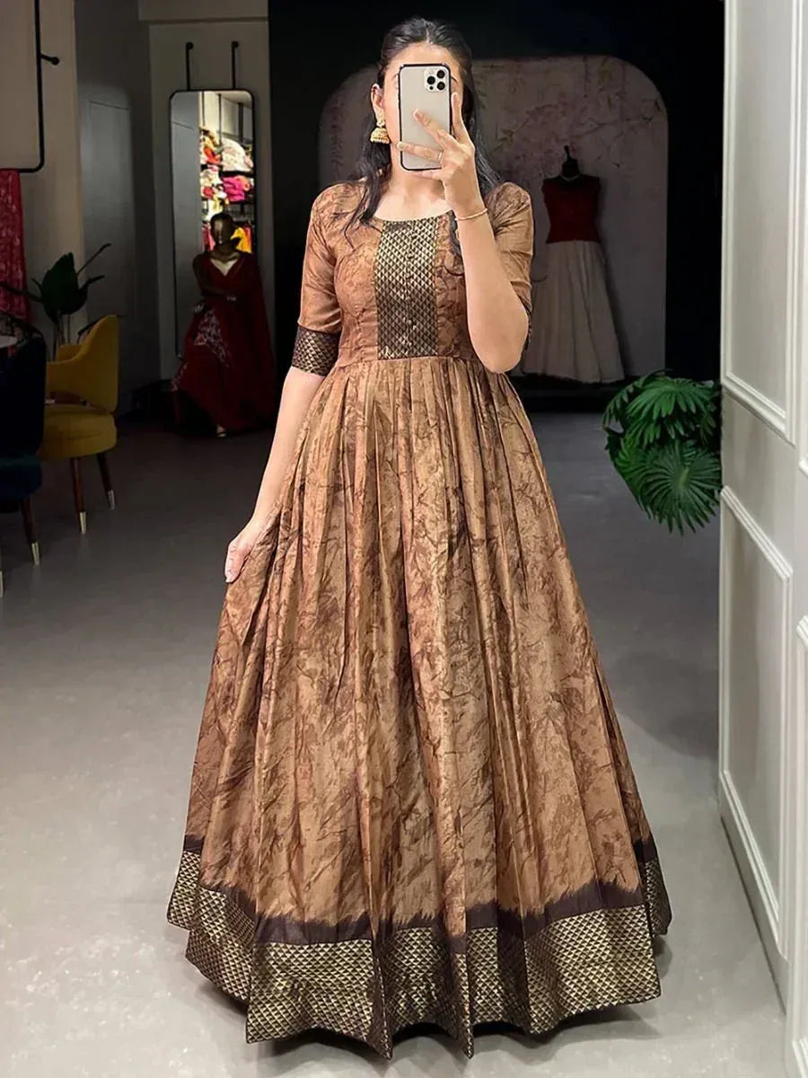 Brown printed ethnic gown with net detailing, perfect for Indian occasions and festive wear