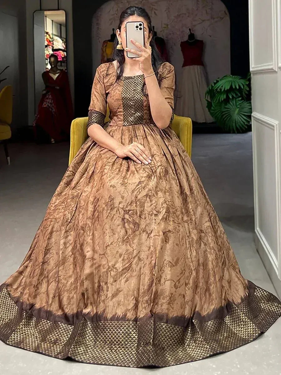 Elegant brown ethnic gown with patterned bodice and flared skirt, perfect for Indian festive occasions.
