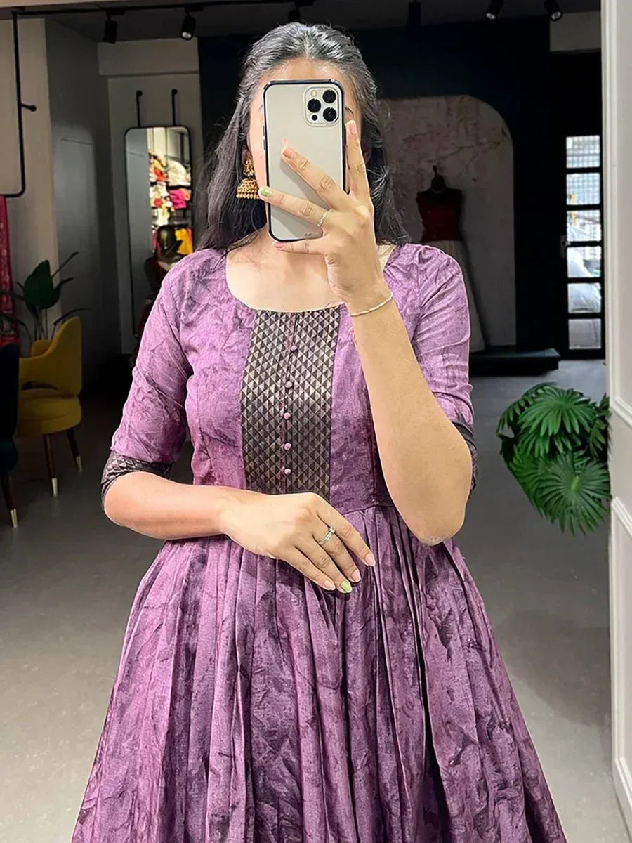 Purple ethnic gown with textured fabric and geometric panel, perfect for Indian occasions