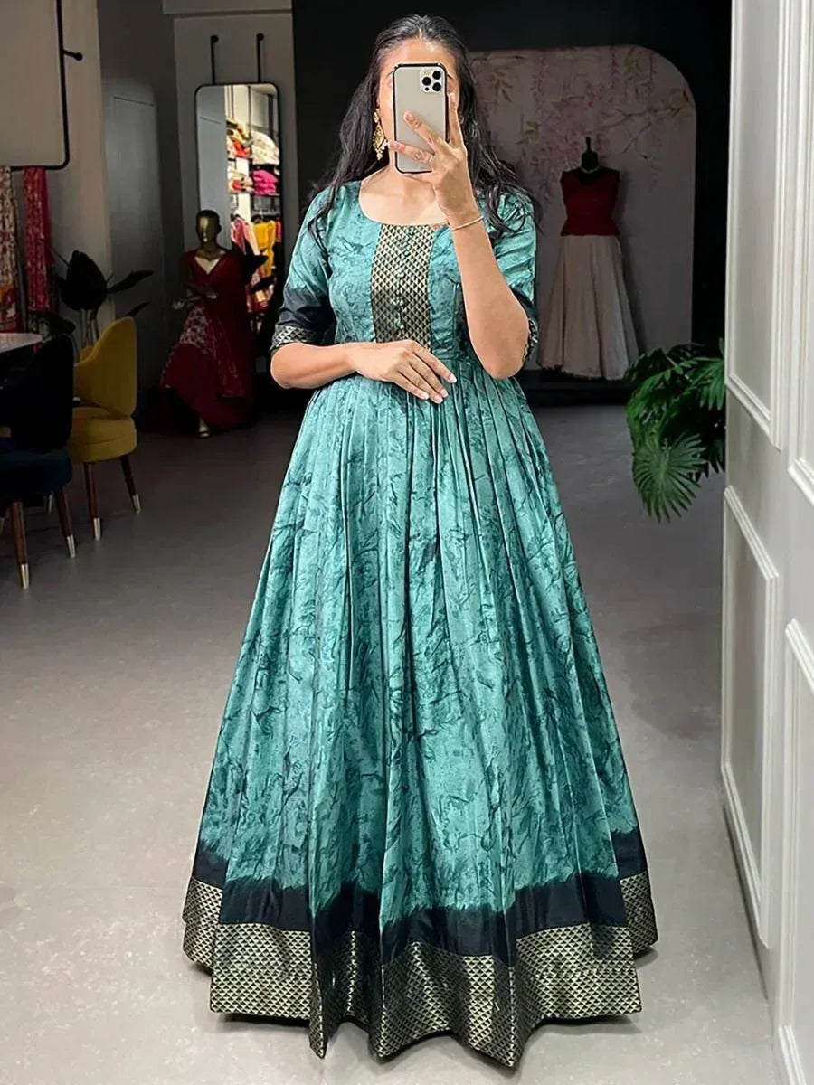 Teal ethnic gown with black geometric border, perfect for Indian occasions and festive wear