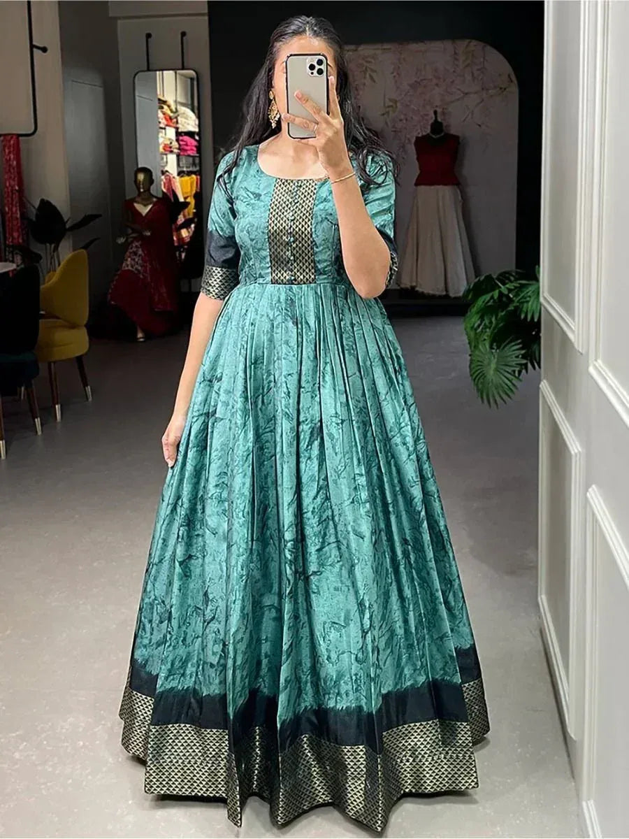 Teal ethnic gown with black geometric border, perfect for Indian festive occasions and weddings.
