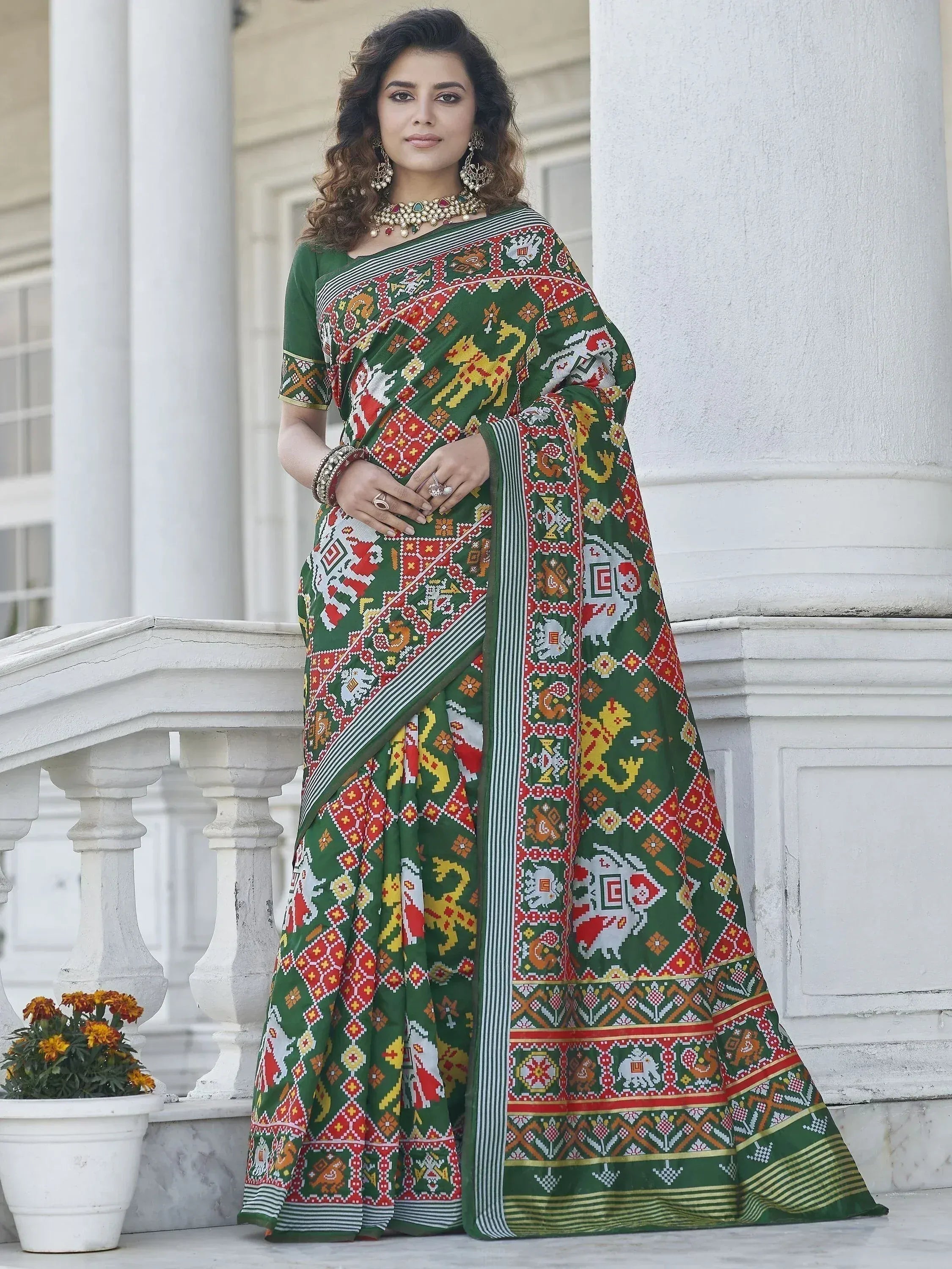 Green printed saree with elephant motifs, traditional Indian ethnic wear for women