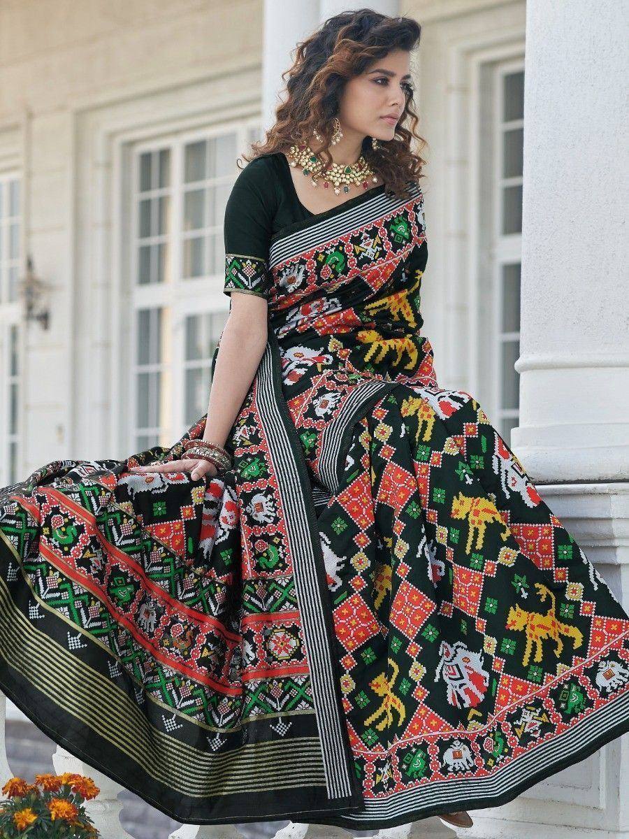 Woman in black ethnic saree with colorful animal & geometric print, traditional Indian wear