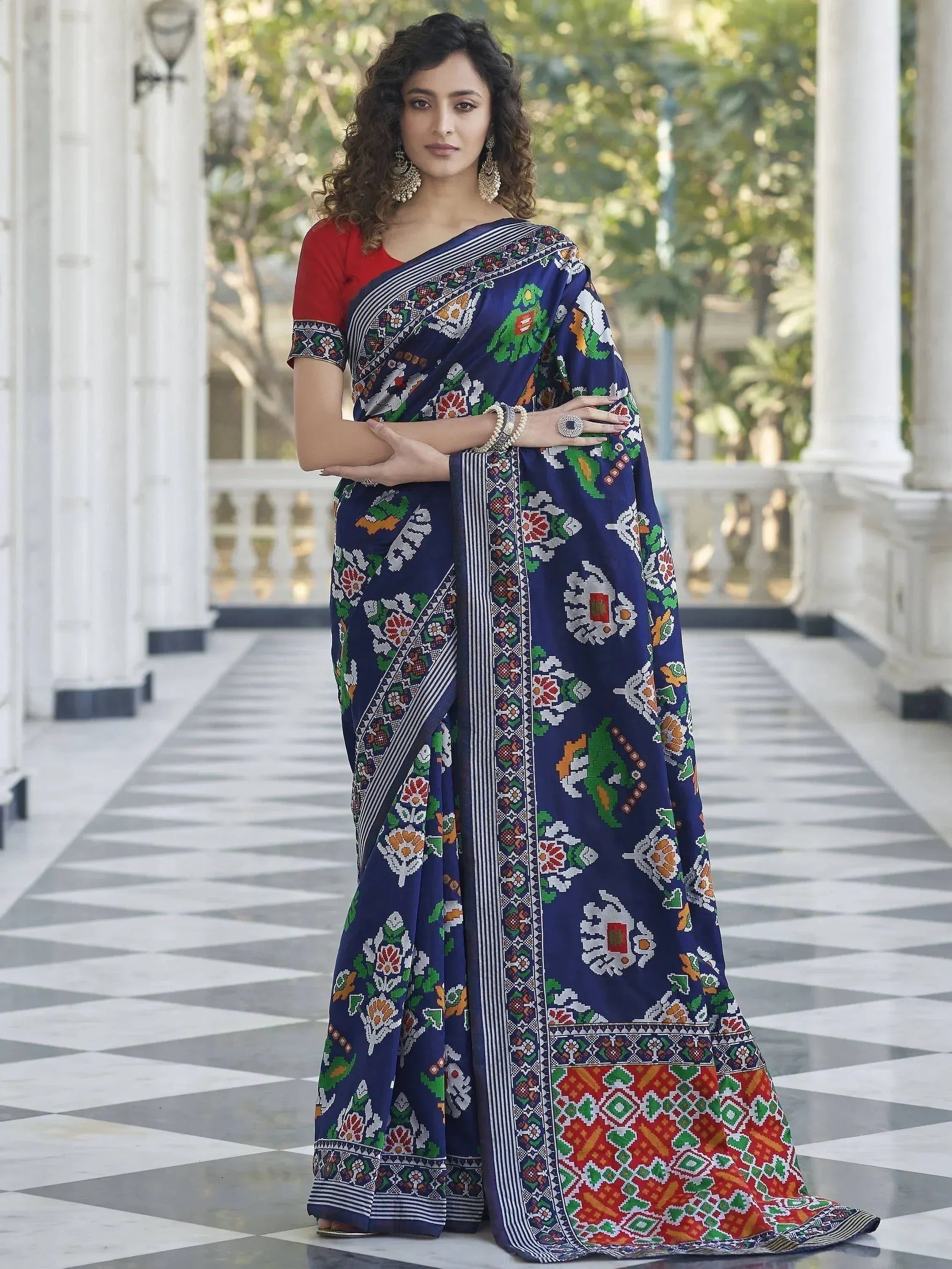 Blue floral printed saree with red blouse, perfect for ethnic occasions
