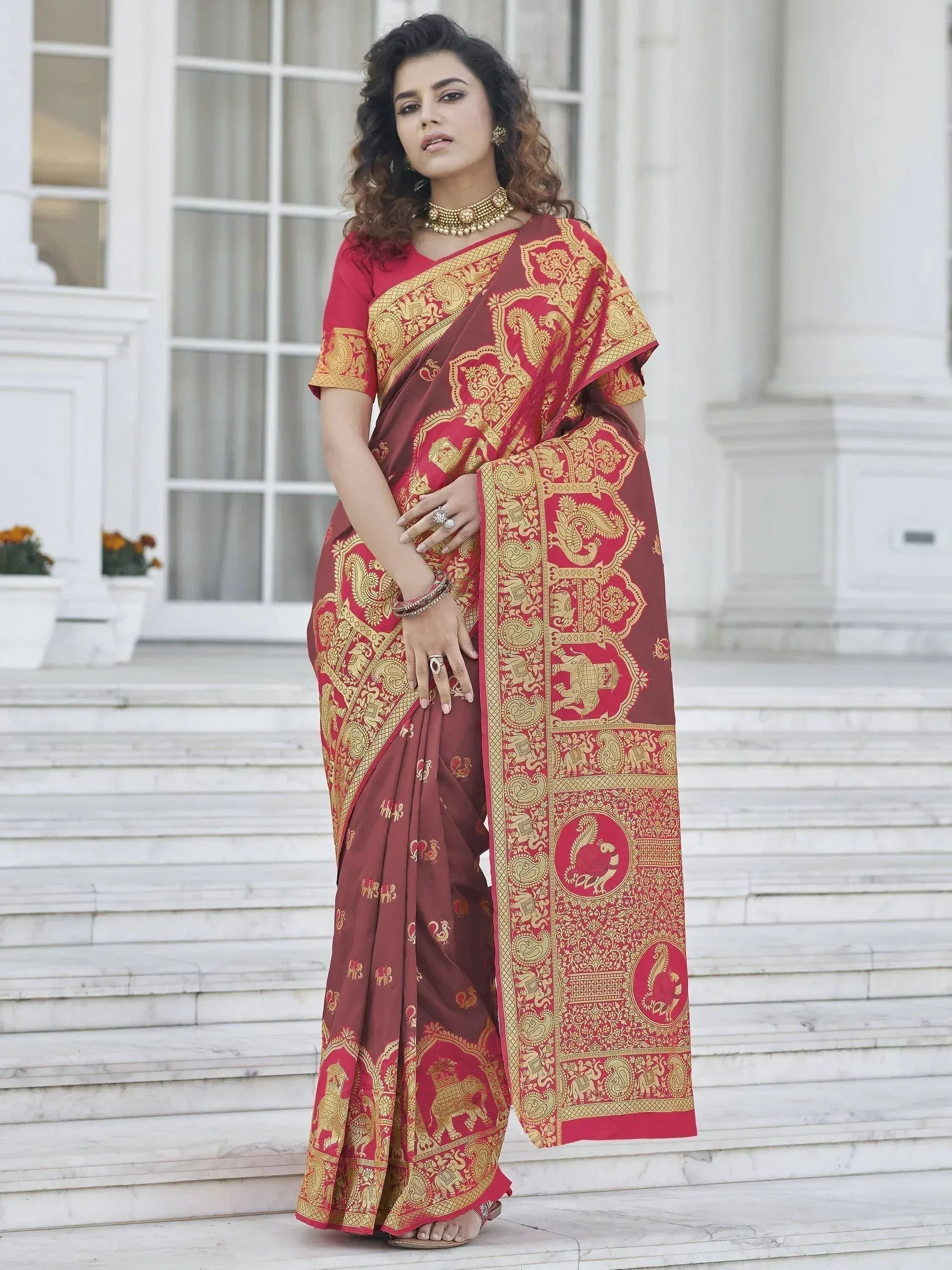 Red and gold ethnic saree with elephant and paisley print, perfect for Indian occasions