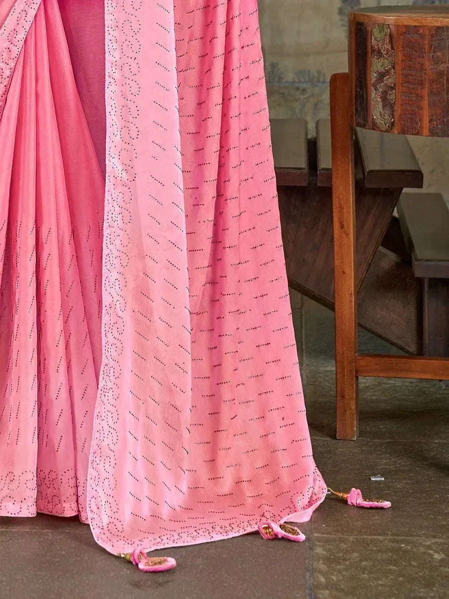 Pink ethnic saree with delicate dot embroidery and tassels, perfect for Indian occasions