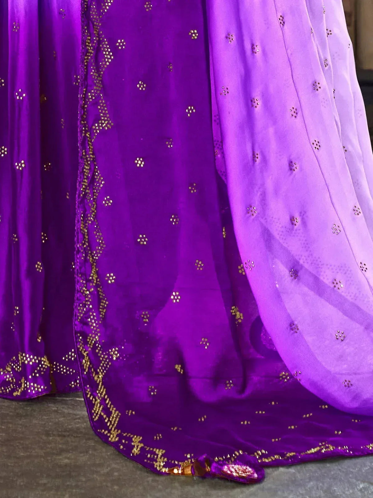 Purple ethnic lehenga with gold embroidery and sheer dupatta, perfect for Indian weddings and festive occasions