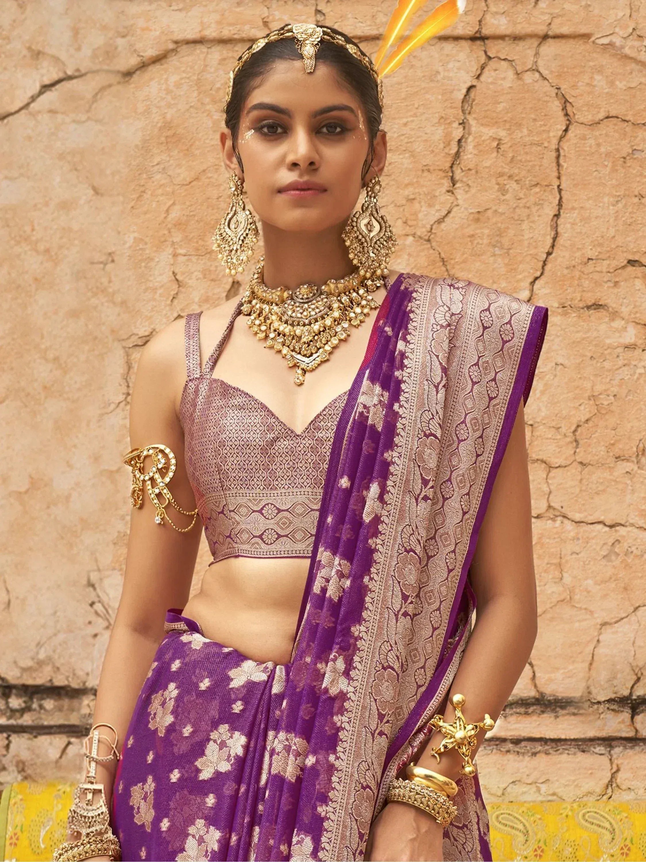 Purple designer lehenga choli with gold embroidery, traditional Indian ethnic wear, heavy jewelry