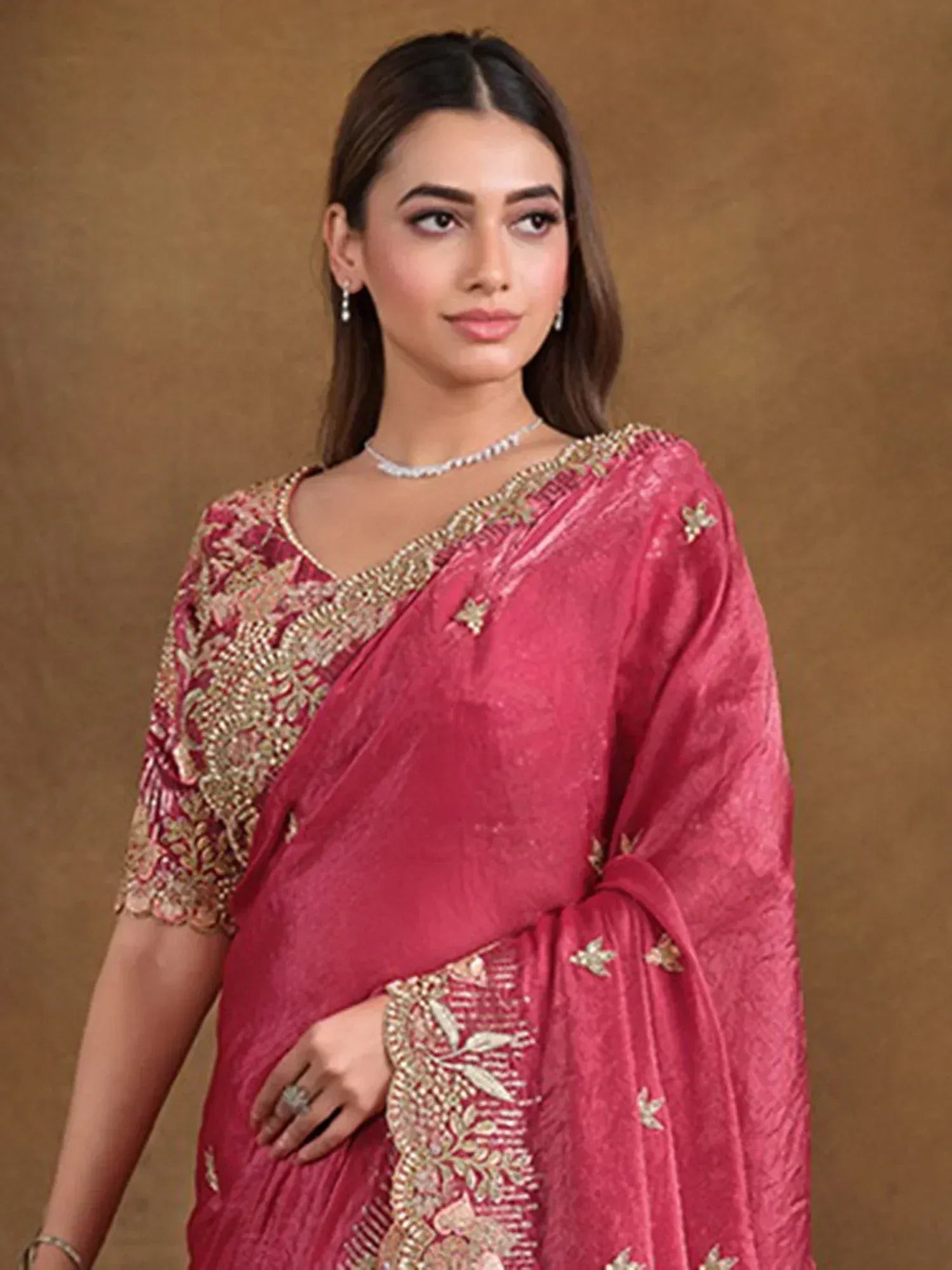 Pink embroidered saree with gold detailing, perfect for Indian ethnic wear and festive occasions.