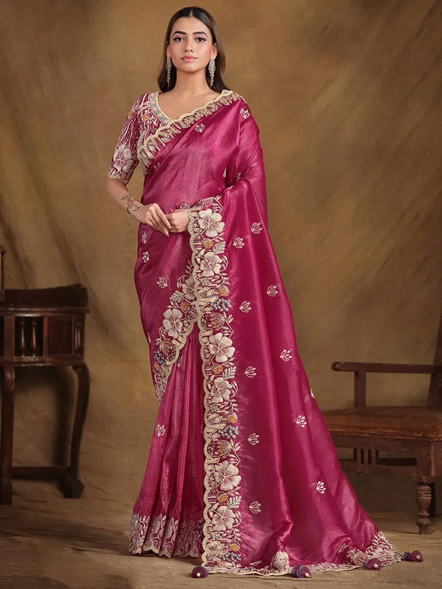 Elegant maroon saree with floral embroidery and gold detailing, perfect for Indian ethnic occasions
