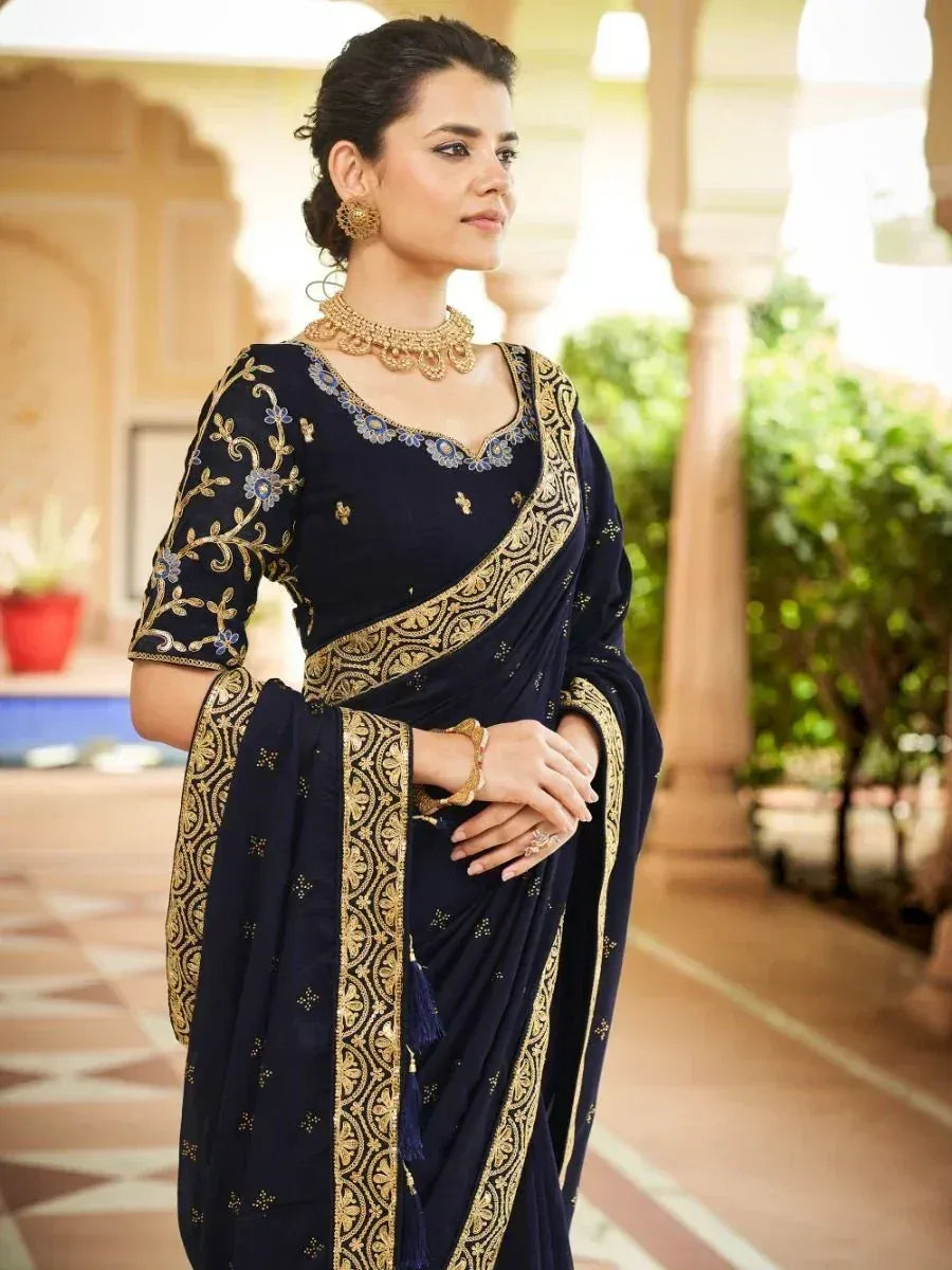 Navy blue designer saree with gold embroidery, perfect for Indian ethnic wear occasions.