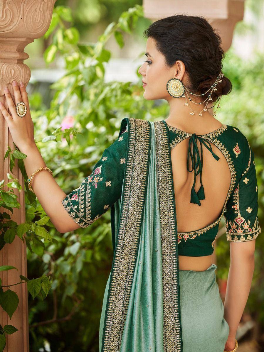 Green embroidered saree with backless blouse, perfect for Indian ethnic occasions