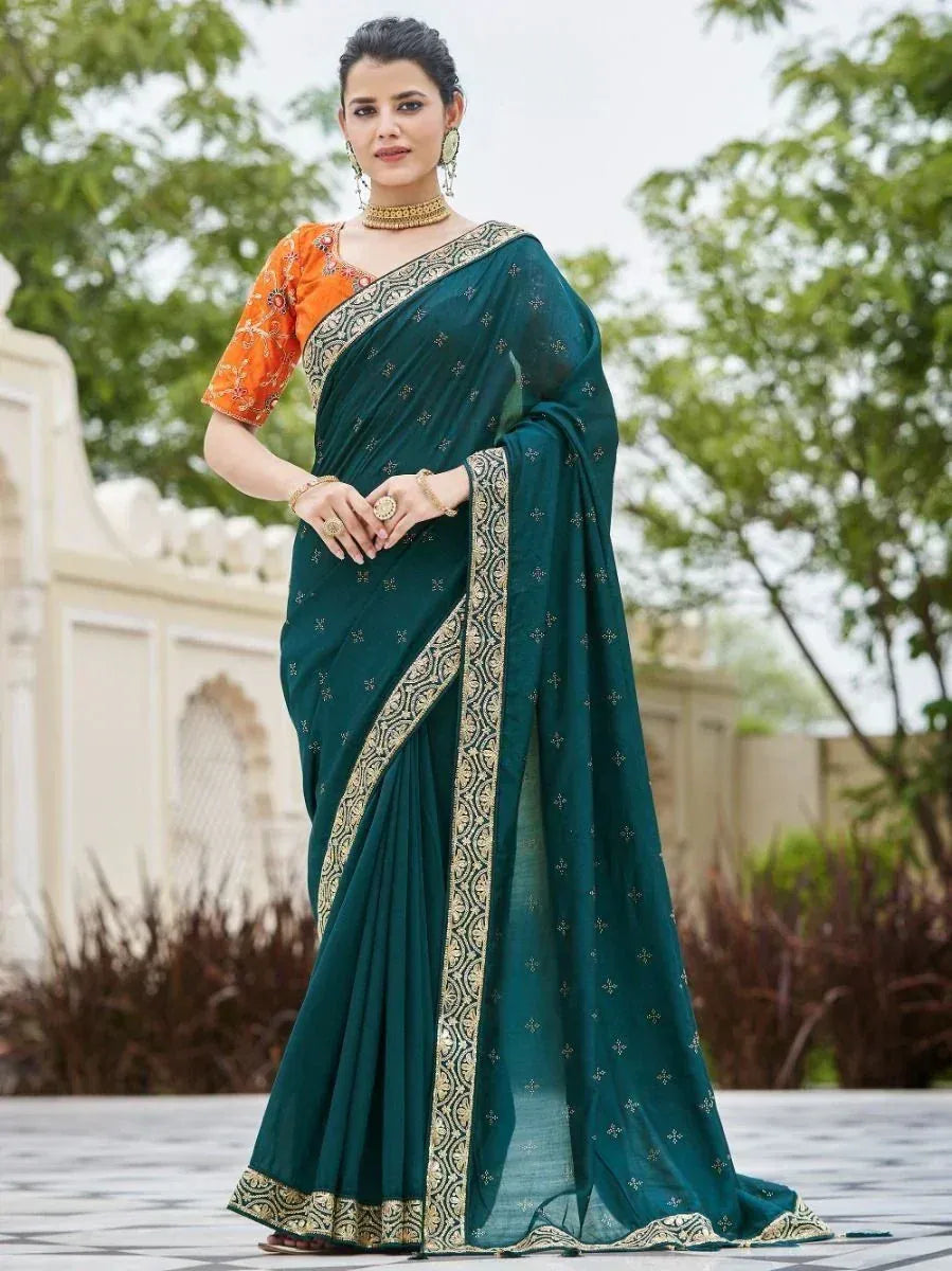 Teal embroidered saree with orange blouse, gold border, perfect for Indian ethnic occasions