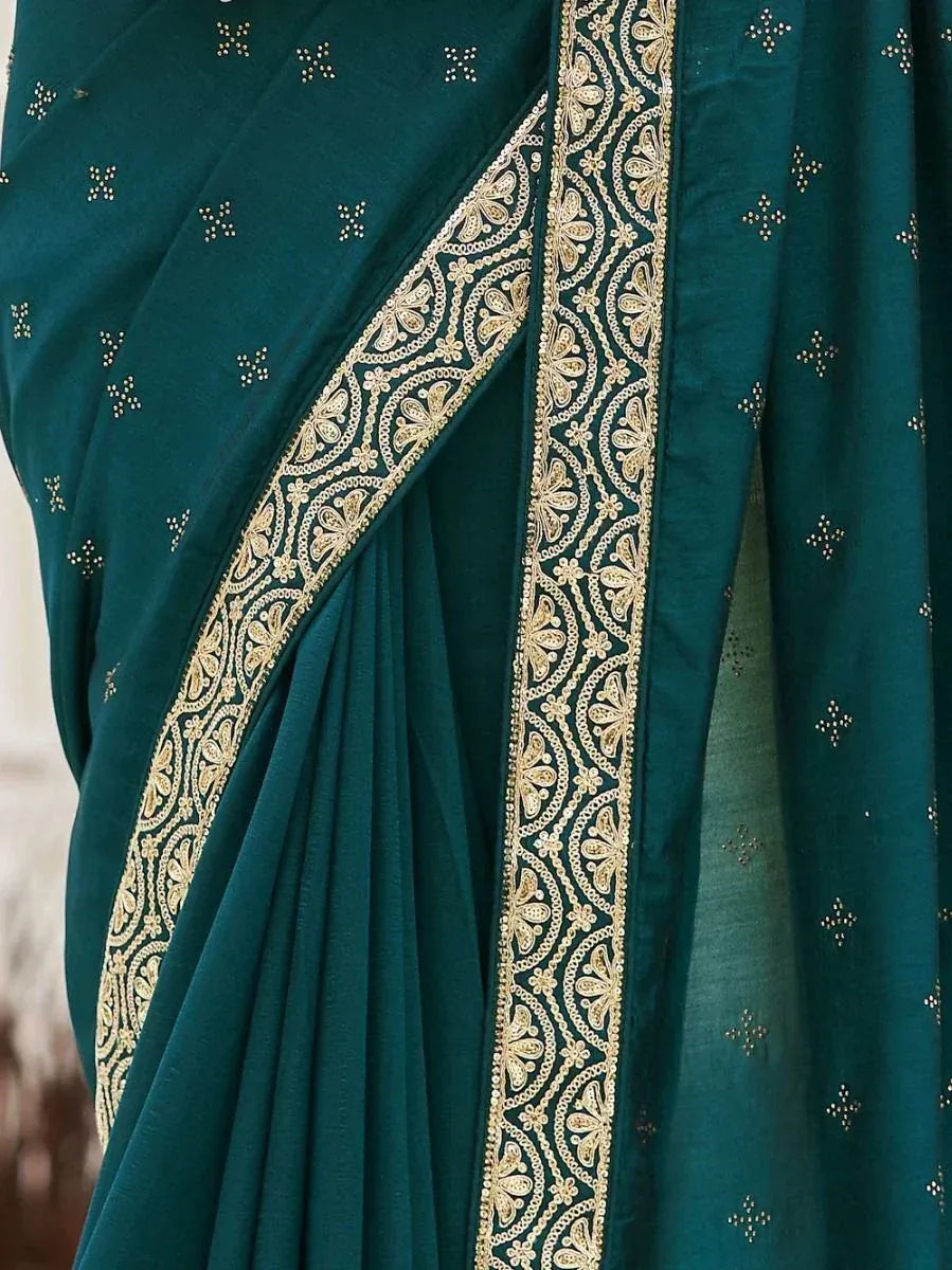 Emerald green saree with gold embroidery and delicate motifs, perfect for ethnic occasions.