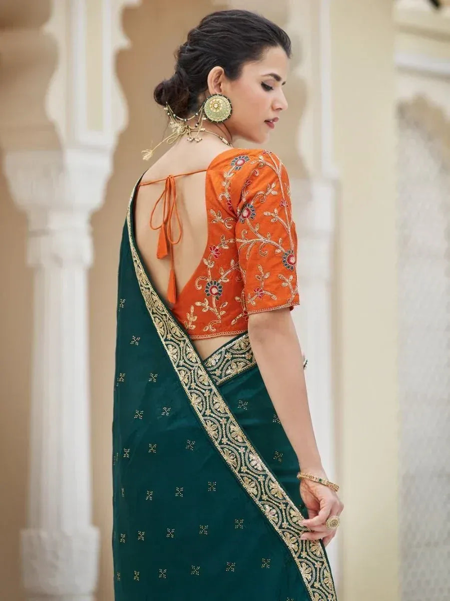 Woman in green saree with gold border and orange embroidered blouse, Indian ethnic wear
