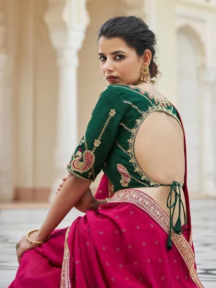 Green embroidered blouse with back cutout paired with pink saree, Indian ethnic wear