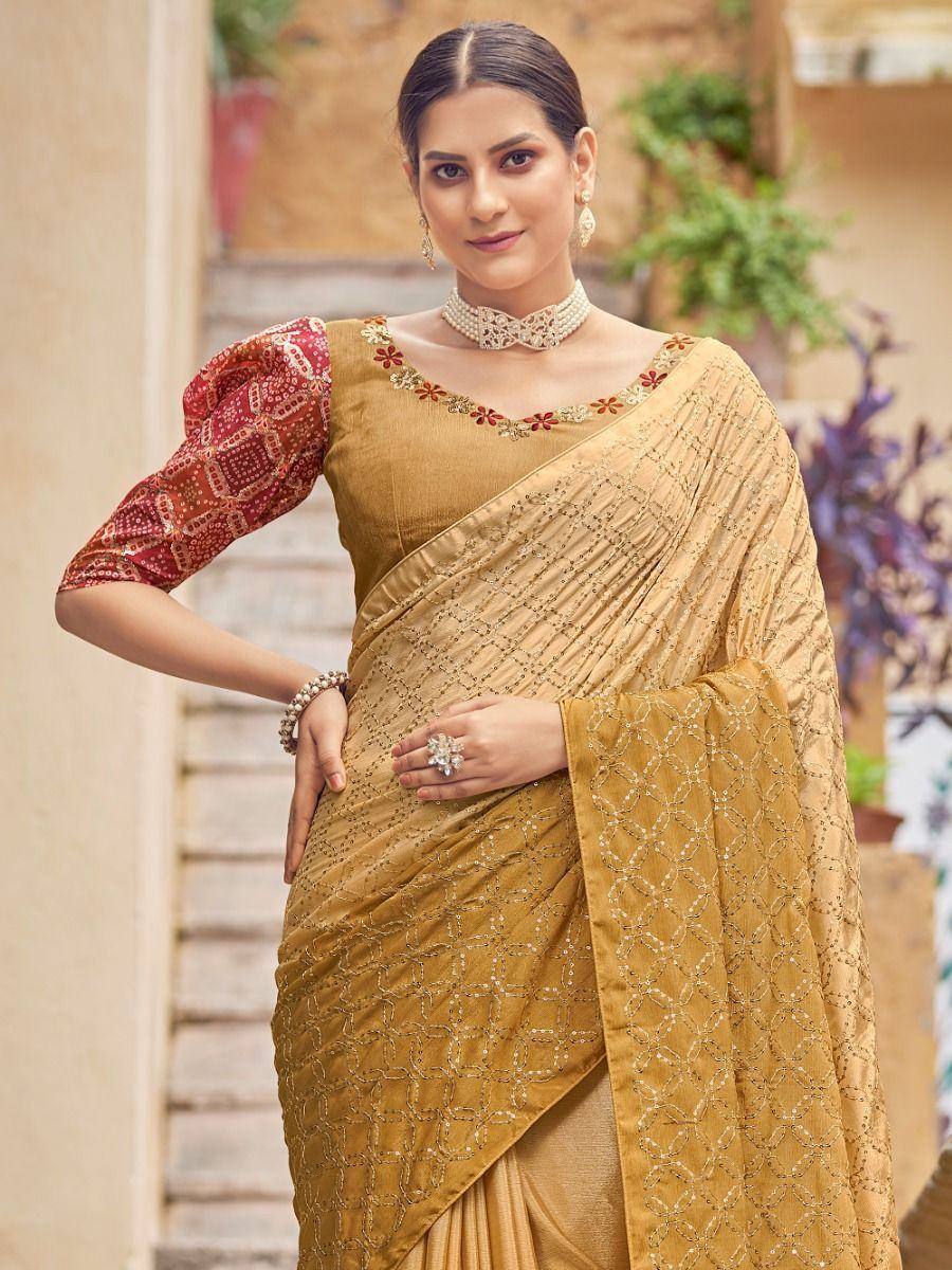 Mustard yellow embroidered saree with red patterned blouse, perfect for Indian ethnic occasions