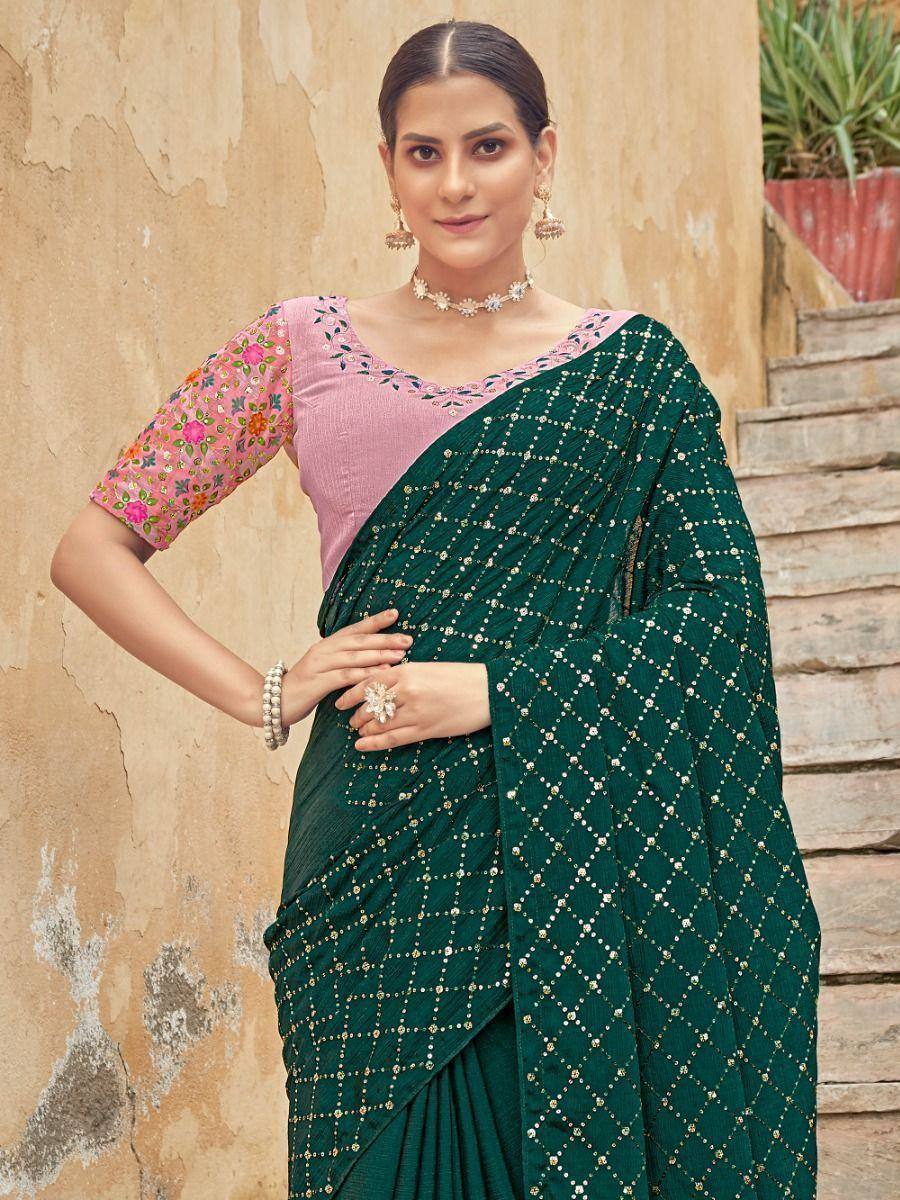 Emerald green saree with gold diamond embroidery, paired with pink floral blouse, perfect for Indian ethnic occasions.