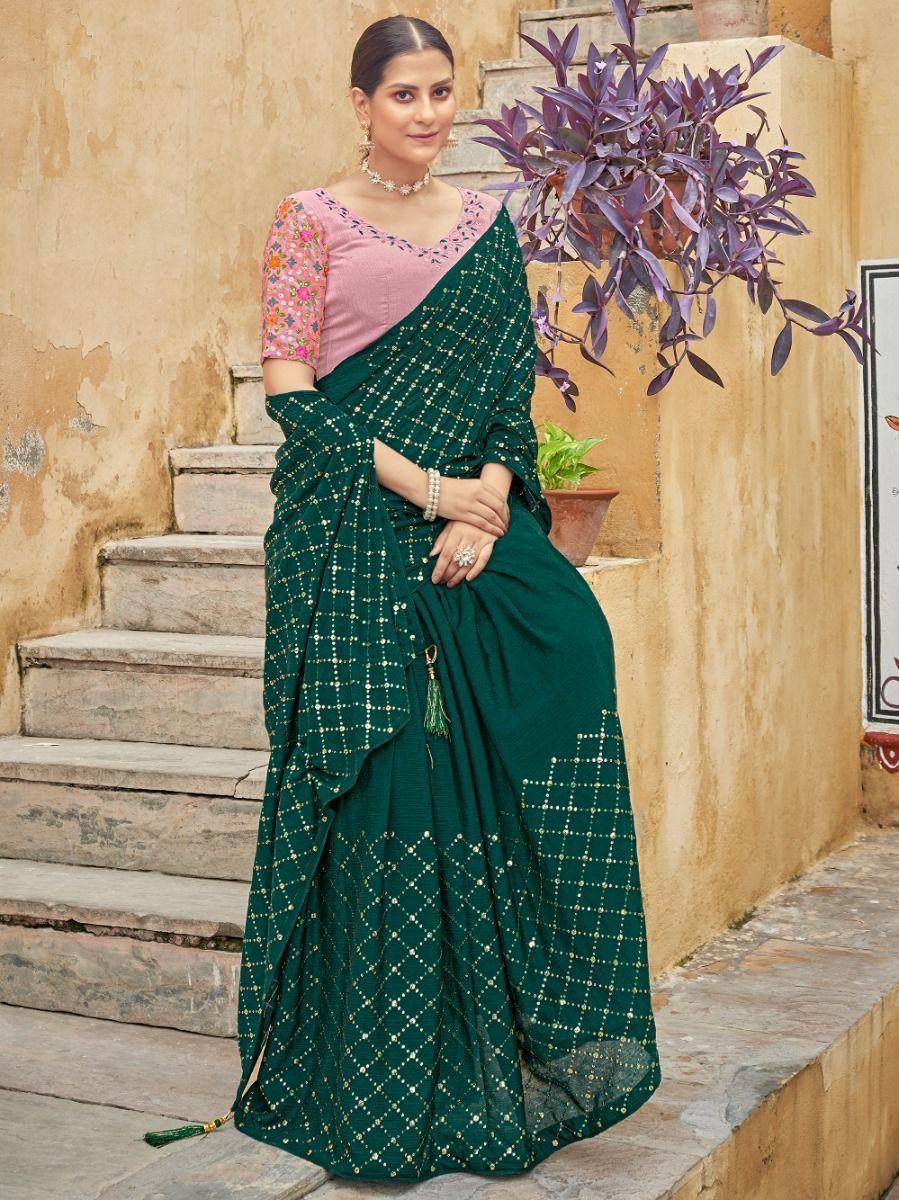 Emerald green saree with gold dot pattern and pink floral blouse, styled for ethnic occasions