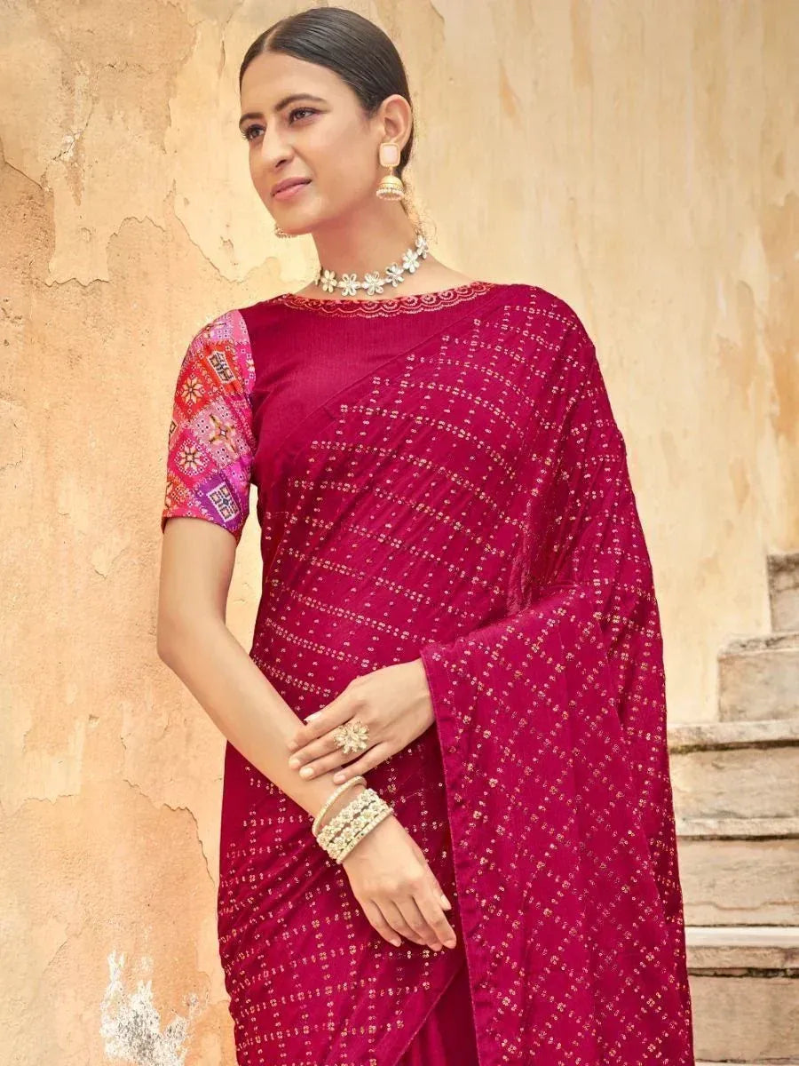 Elegant maroon saree with gold embroidery and colorful blouse, styled with traditional jewelry for ethnic occasions