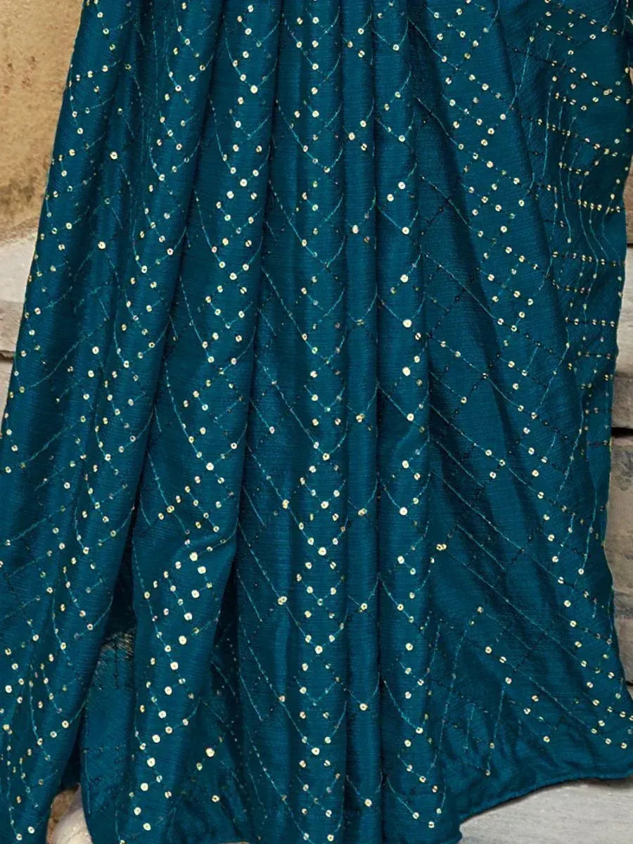 Teal ethnic gown with gold dot embroidery and diamond pattern, perfect for Indian occasions