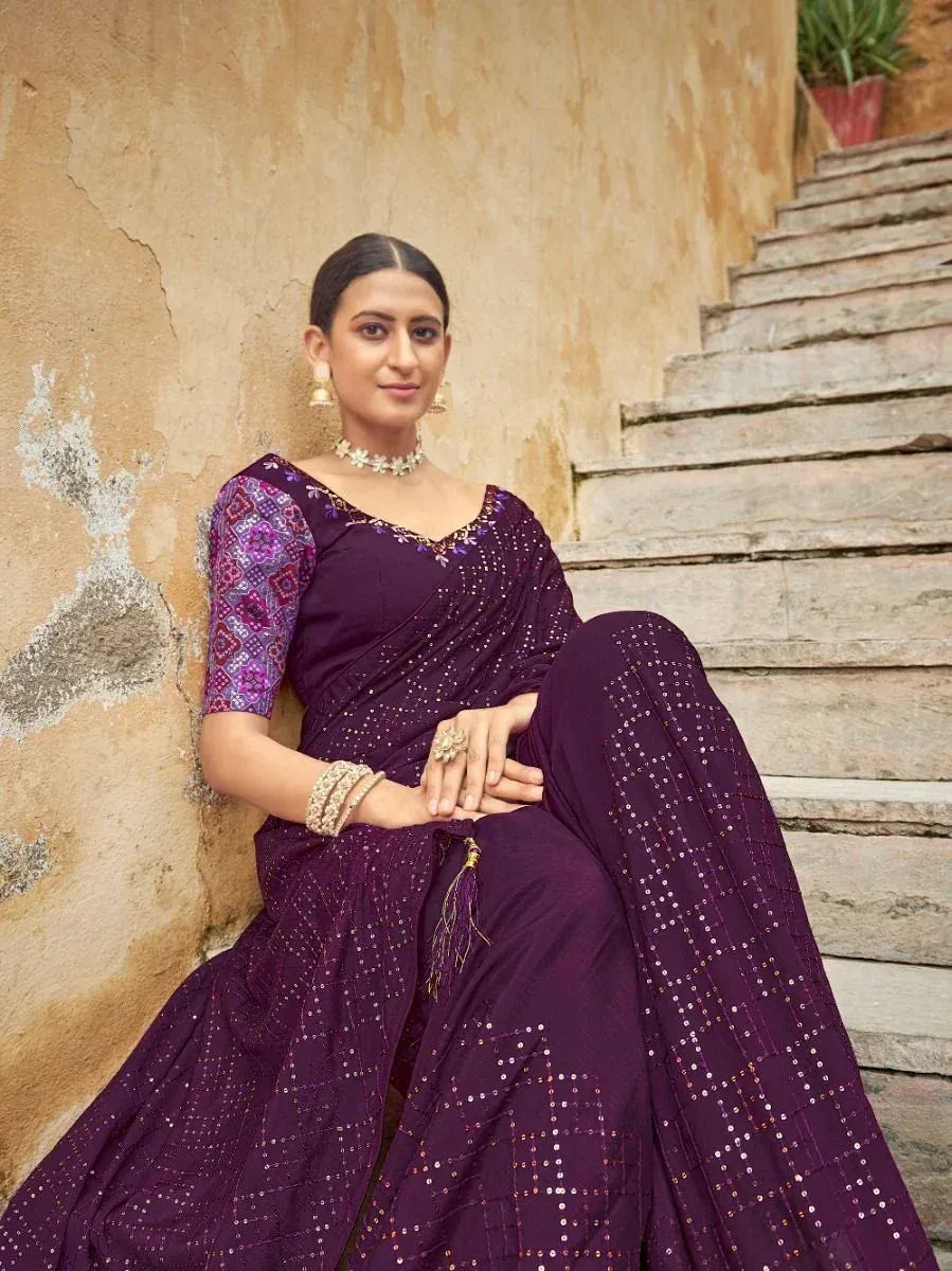Purple ethnic saree with sequin work and printed blouse, styled with jewelry for festive occasions