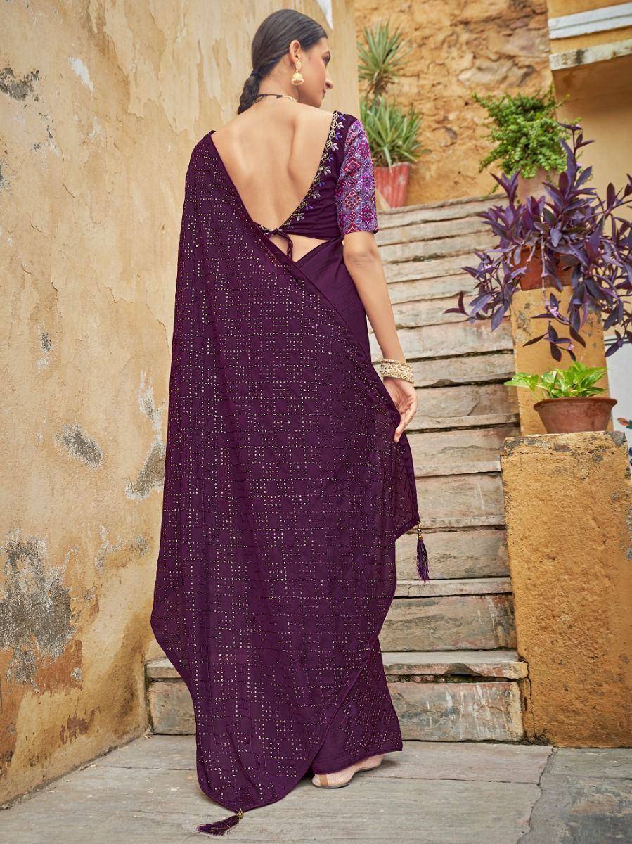 Purple embroidered saree with backless blouse, perfect for ethnic occasions