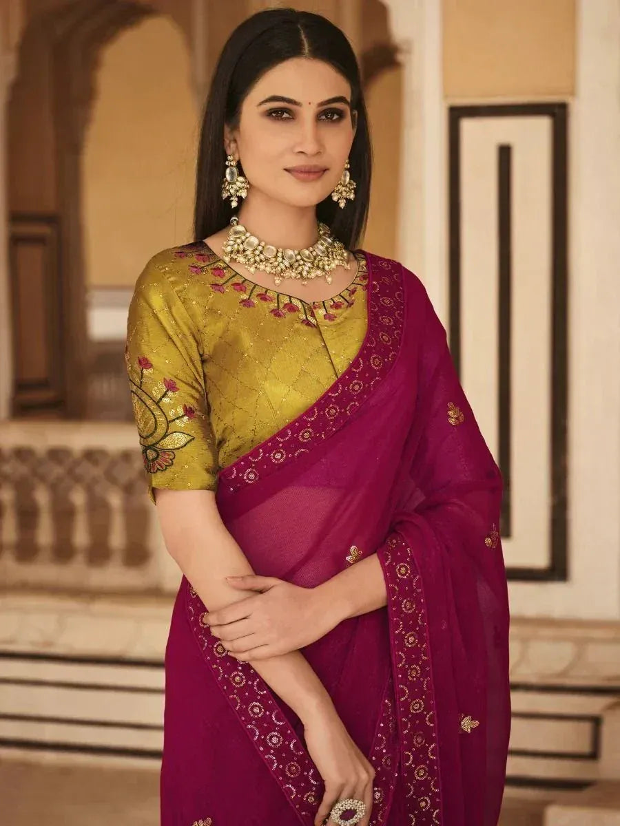 Woman in maroon saree with gold embroidered blouse, traditional Indian ethnic wear