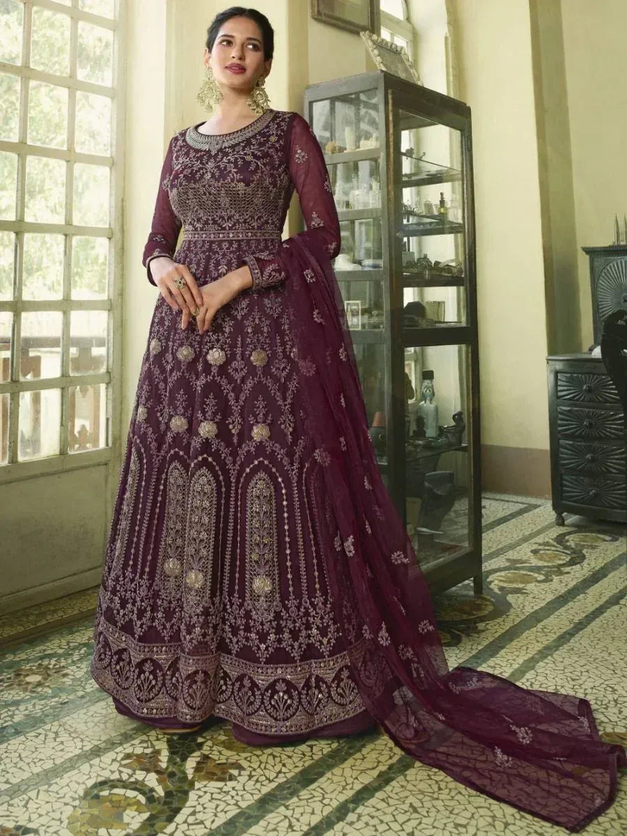 Elegant maroon designer anarkali with intricate gold embroidery, perfect for Indian ethnic occasions.