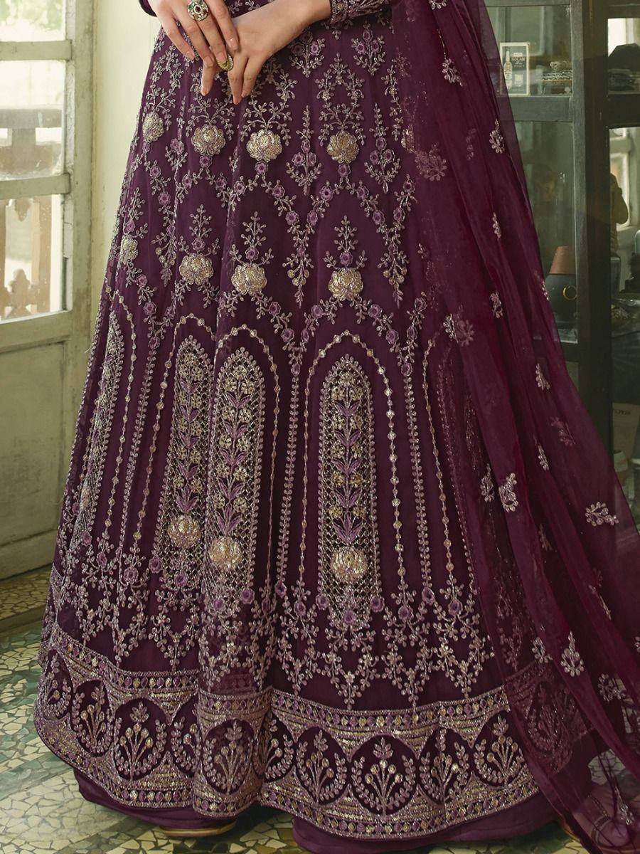 Purple embroidered lehenga choli with gold floral detailing, perfect for Indian ethnic wear occasions