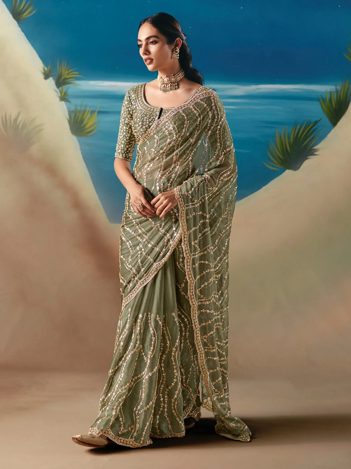 Olive green designer saree with gold embroidery, perfect for Indian ethnic wear and festive occasions.