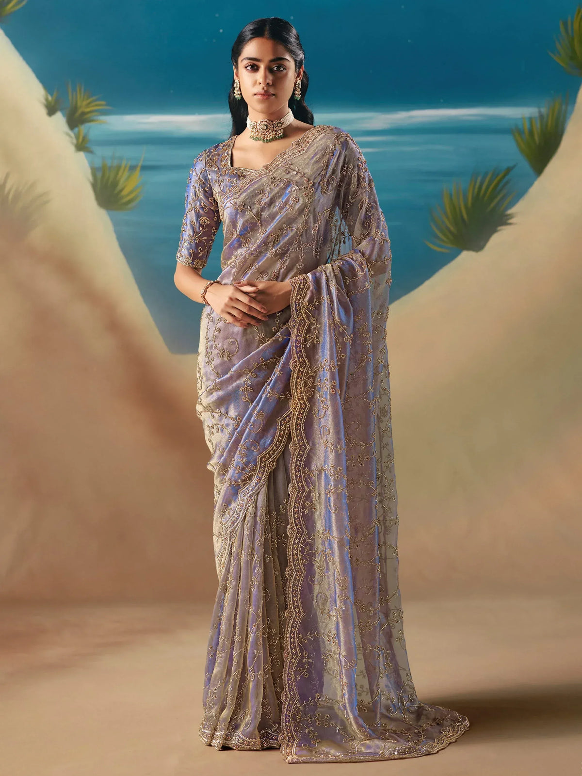 Elegant lavender saree with gold embroidery, perfect for Indian ethnic wear occasions.
