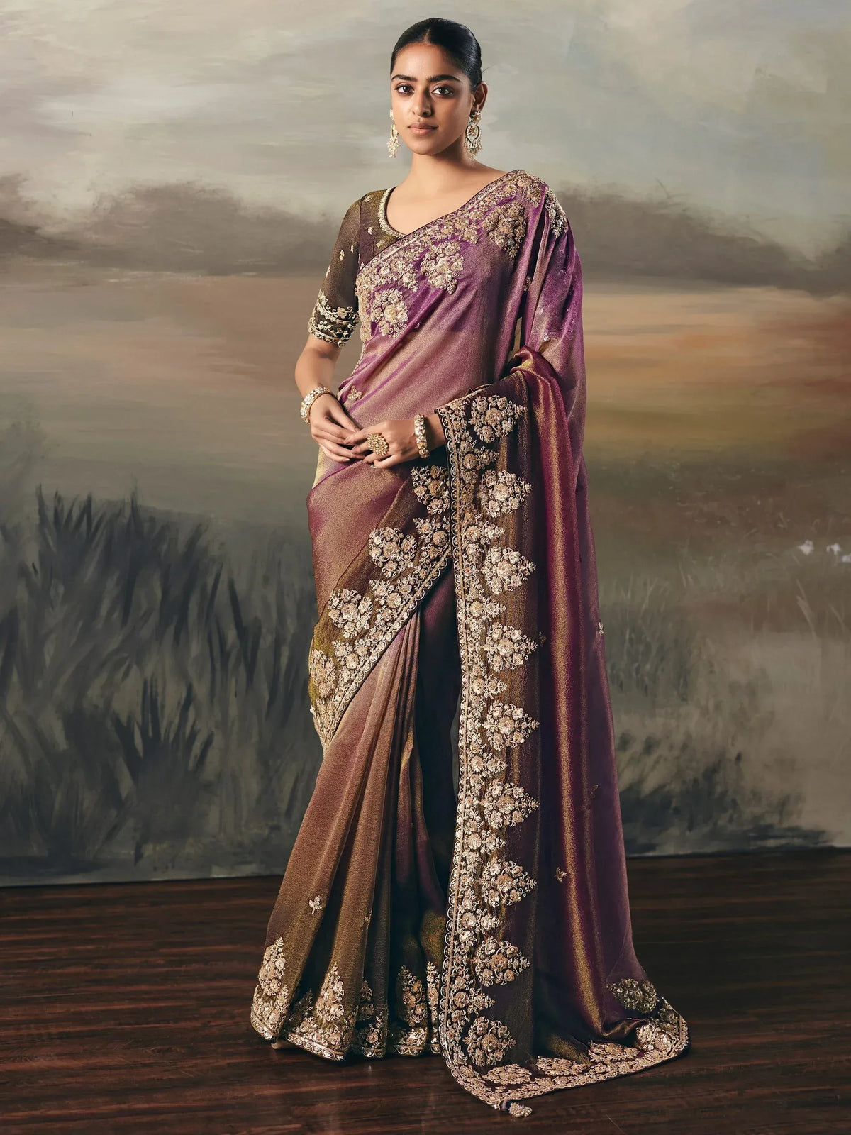 Elegant purple and gold embroidered saree with floral detailing, perfect for Indian ethnic wear occasions.