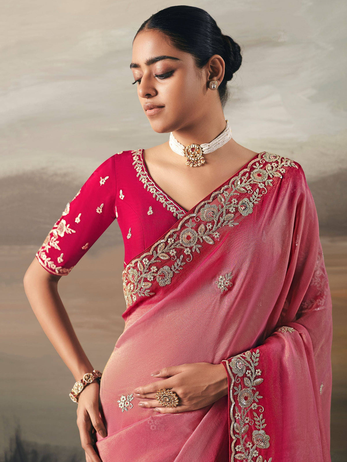 Elegant pink saree with gold floral embroidery, perfect for Indian ethnic wear occasions