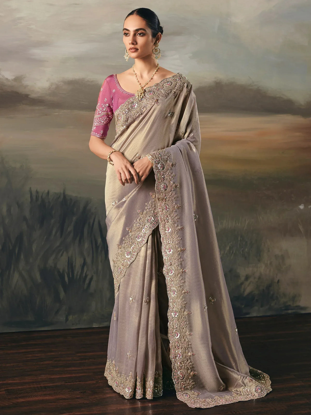 Elegant beige saree with intricate embroidery and pink blouse, perfect for Indian ethnic wear occasions.
