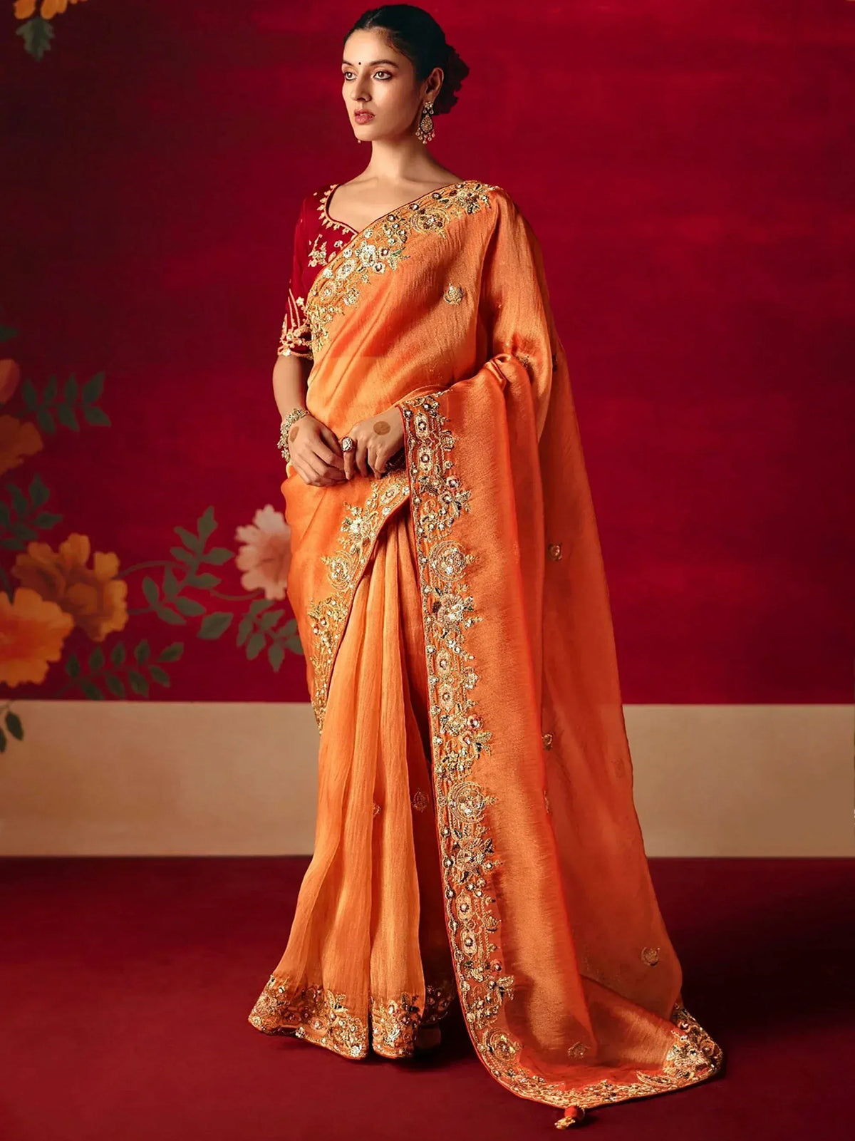 Orange embroidered saree with red blouse, perfect for Indian ethnic wear and festive occasions.