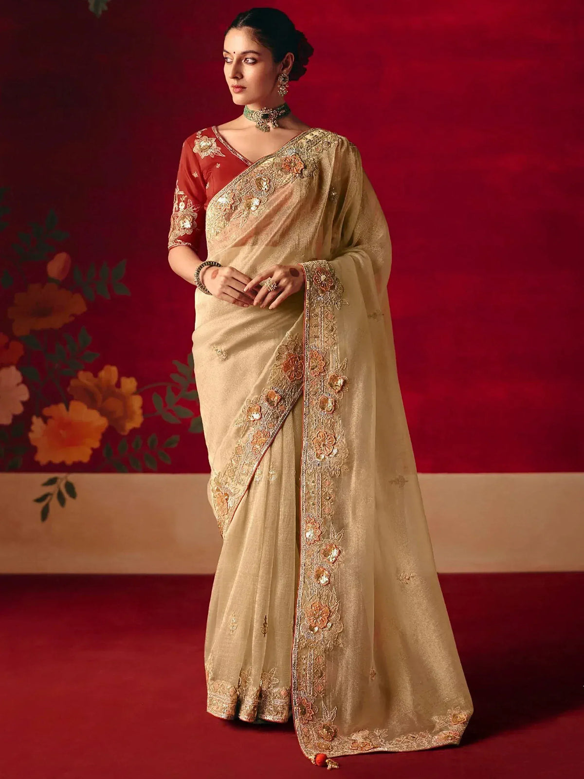Elegant beige saree with floral embroidery and red blouse, perfect for Indian ethnic occasions