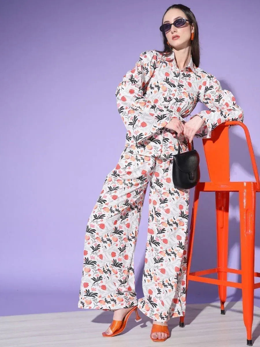 Floral print ethnic jumpsuit with wide-leg pants, styled with orange heels and sunglasses for modern Indian fashion