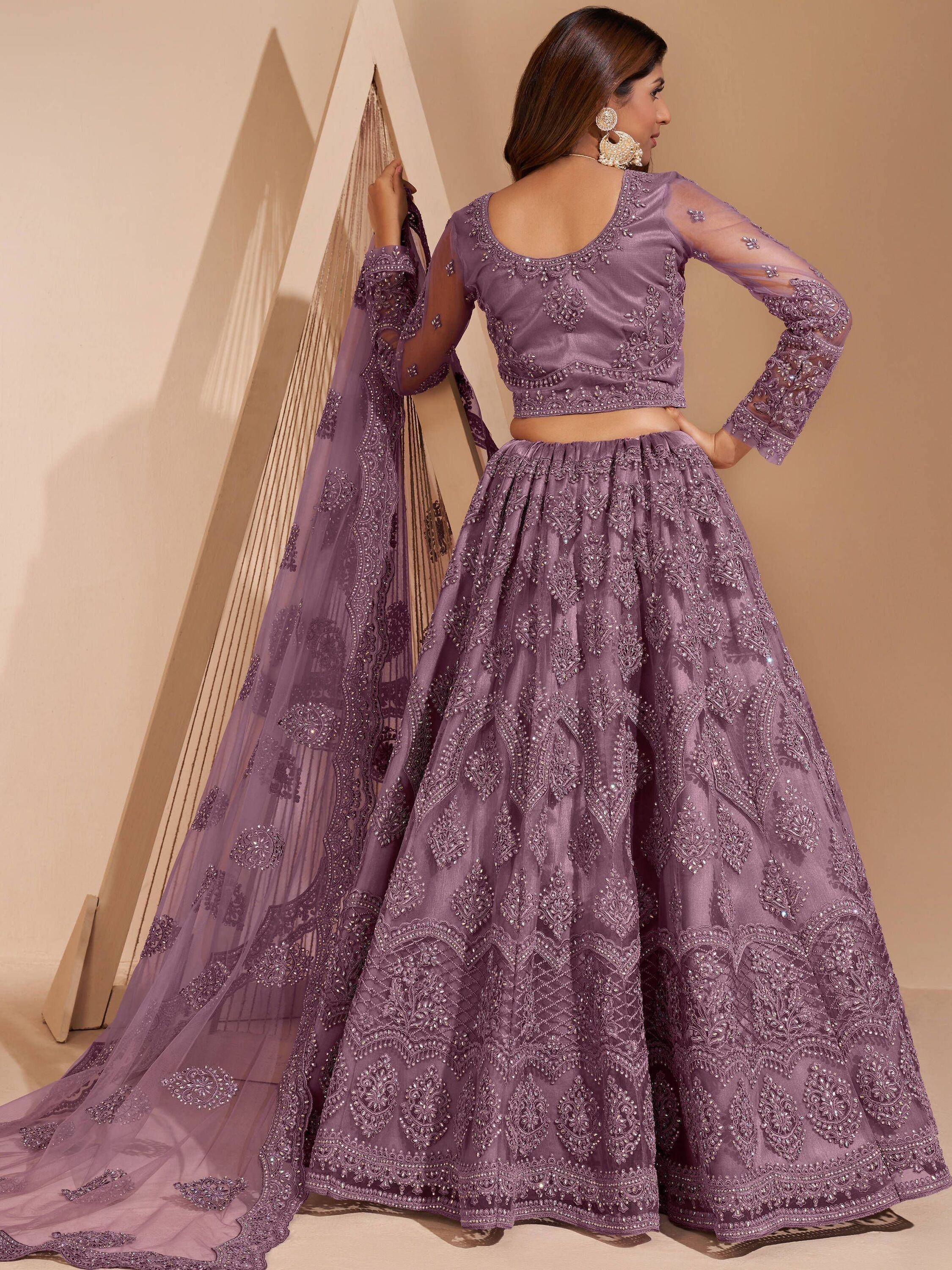 Purple embroidered lehenga choli with sheer sleeves and dupatta, perfect for Indian ethnic occasions