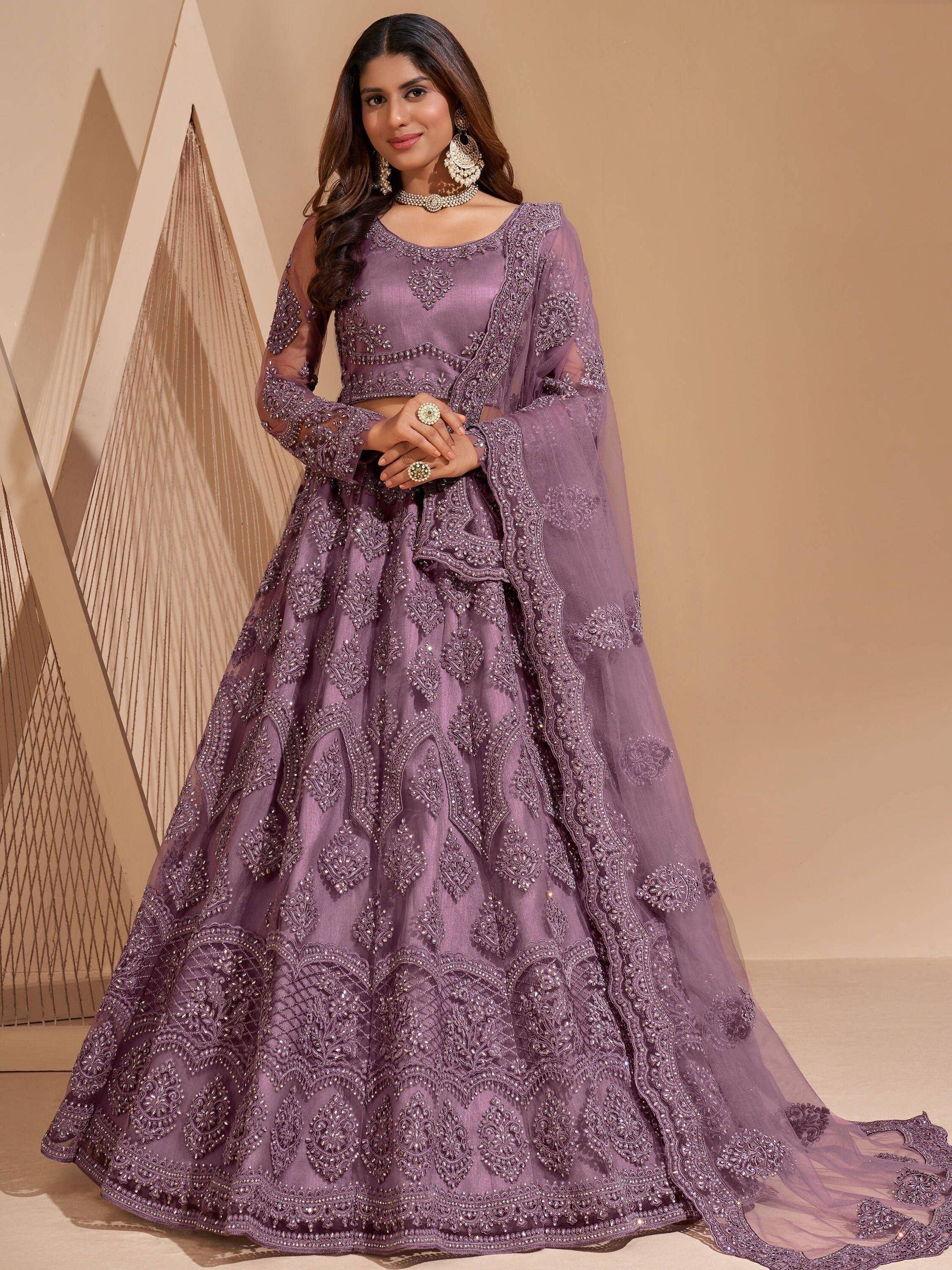 Elegant purple designer lehenga choli with heavy embroidery and sheer dupatta for Indian ethnic wear