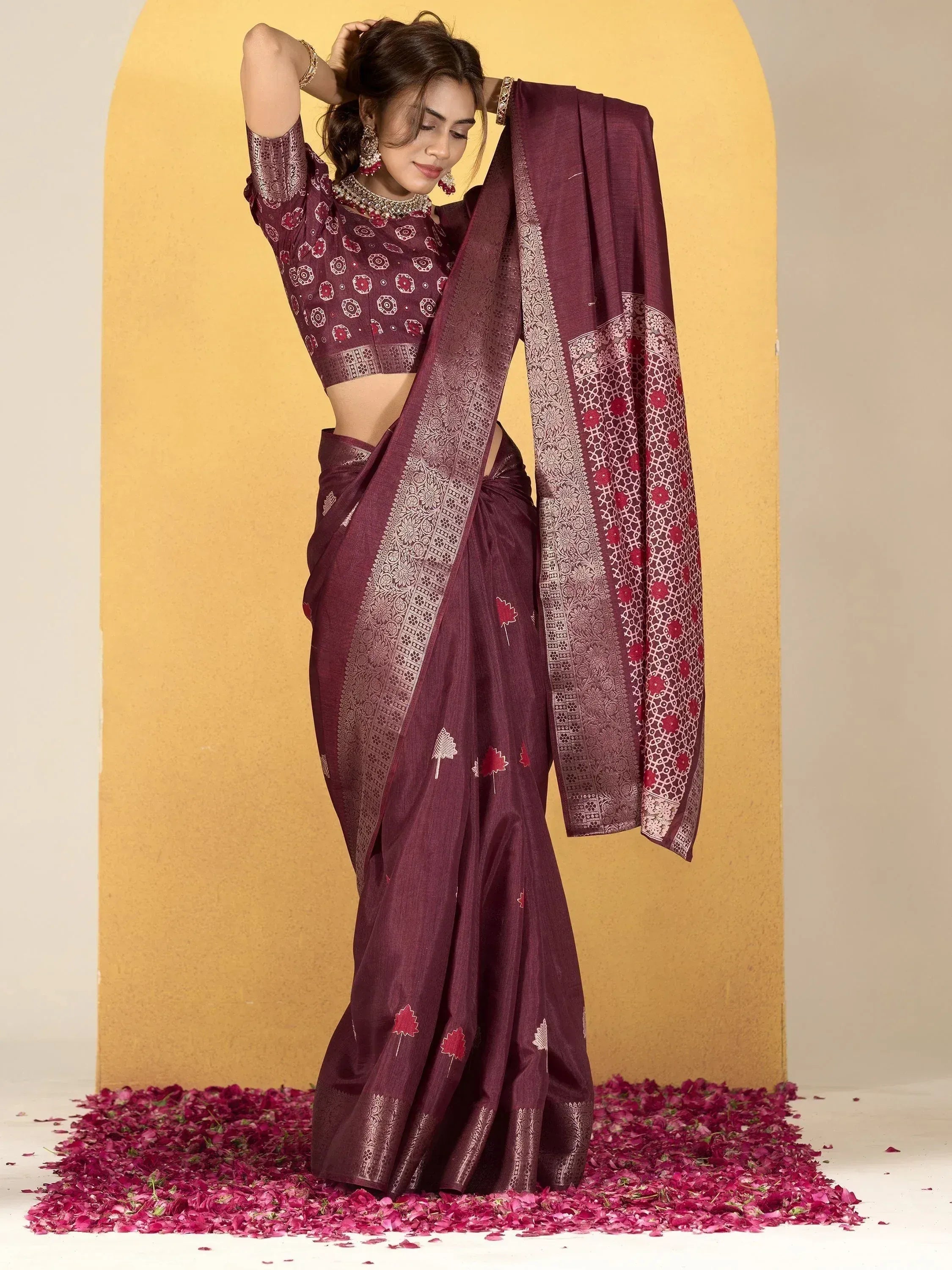 Elegant maroon saree with floral print and gold border, paired with matching blouse, ideal for Indian ethnic occasions.