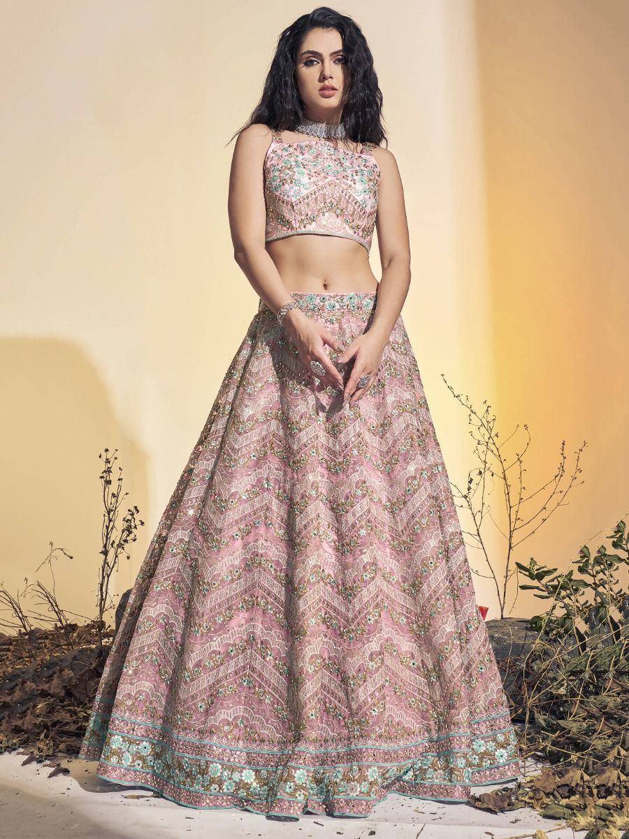 Pink floral embroidered lehenga choli with halter neck top, perfect for Indian ethnic occasions
