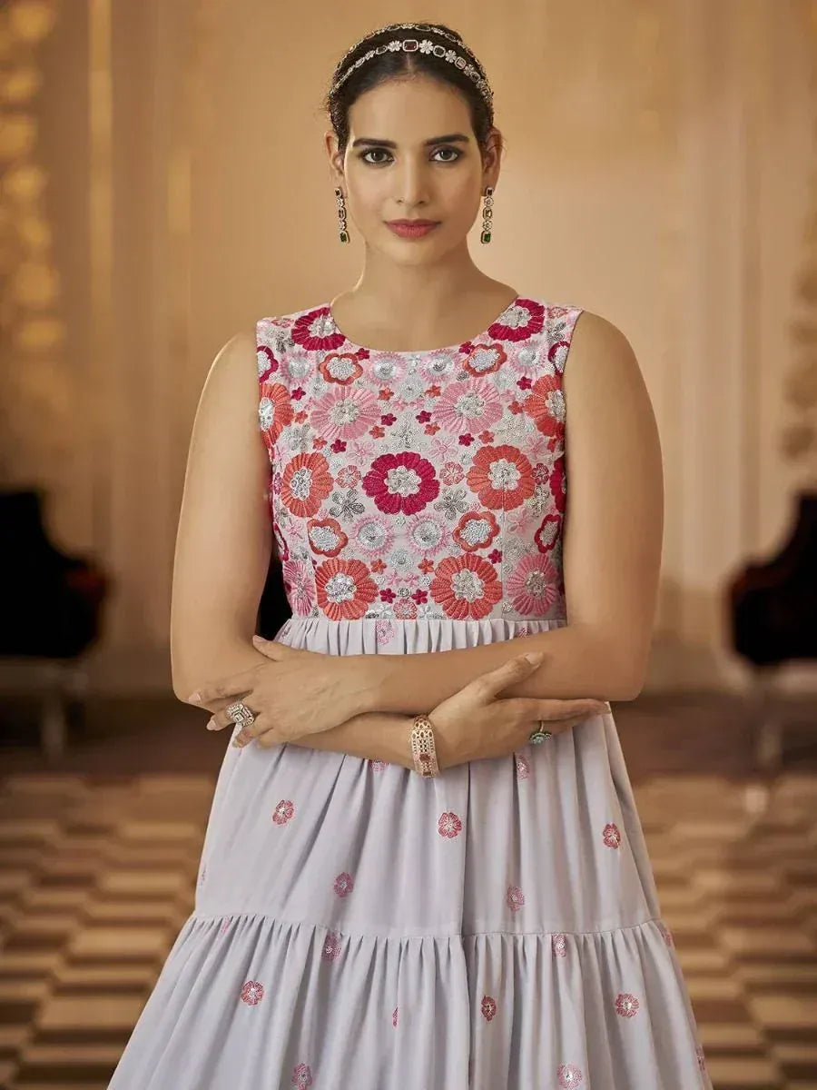 Floral embroidered ethnic gown with pastel skirt, perfect for Indian occasions and weddings