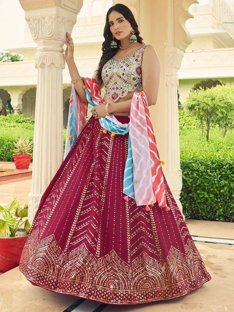 Maroon embroidered lehenga choli with floral blouse and colorful dupatta, perfect for Indian ethnic occasions