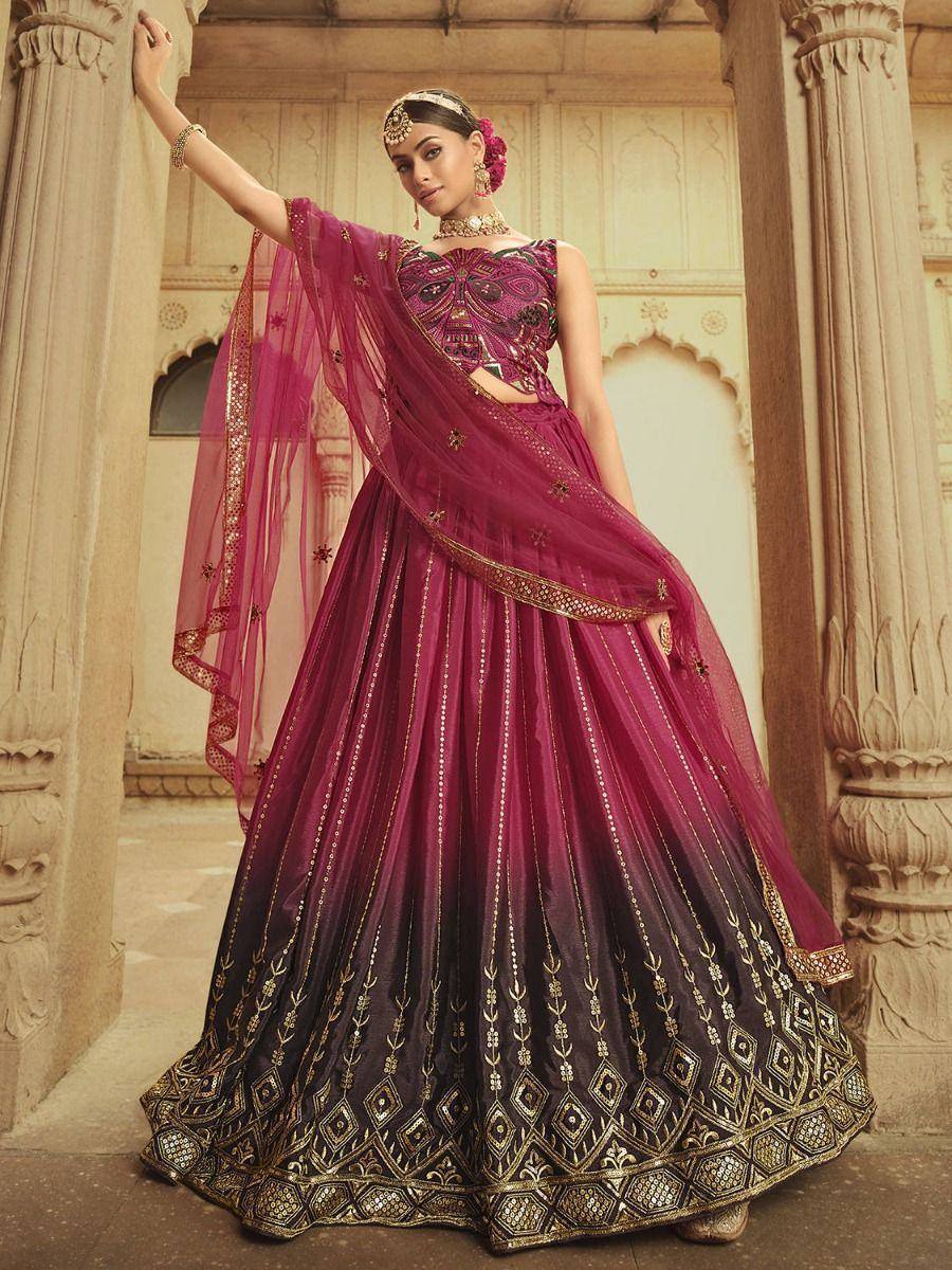 Elegant maroon lehenga choli with gold embroidery, perfect for Indian weddings and festive occasions.