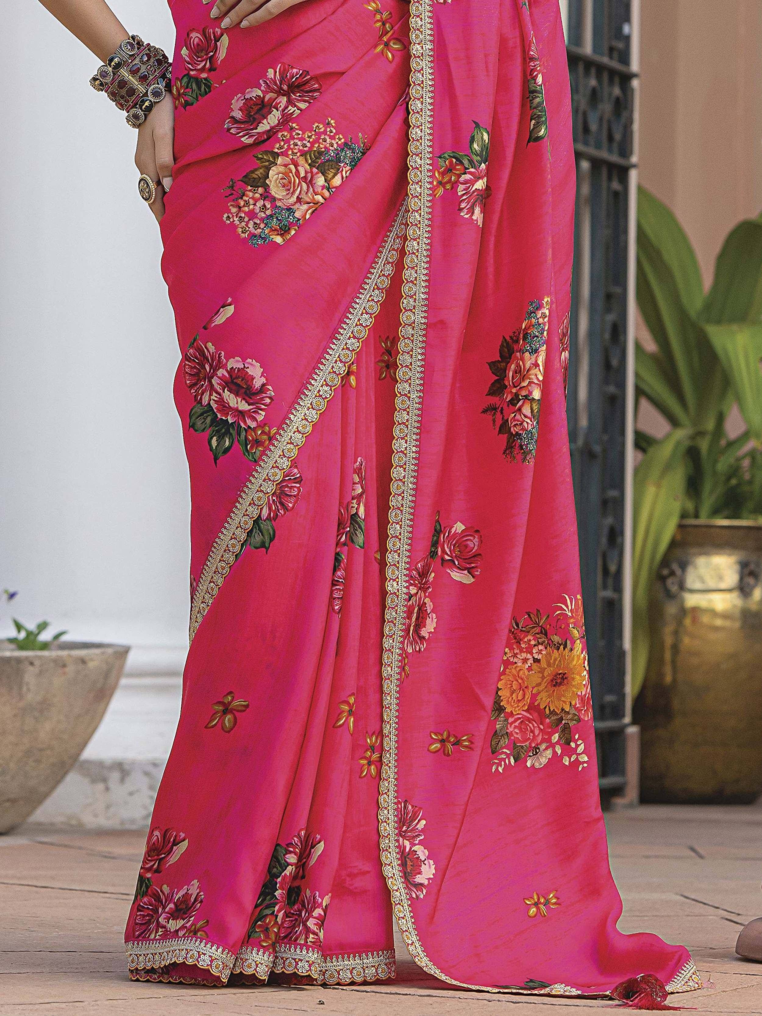 Vibrant pink floral saree with gold border, perfect for Indian ethnic wear occasions