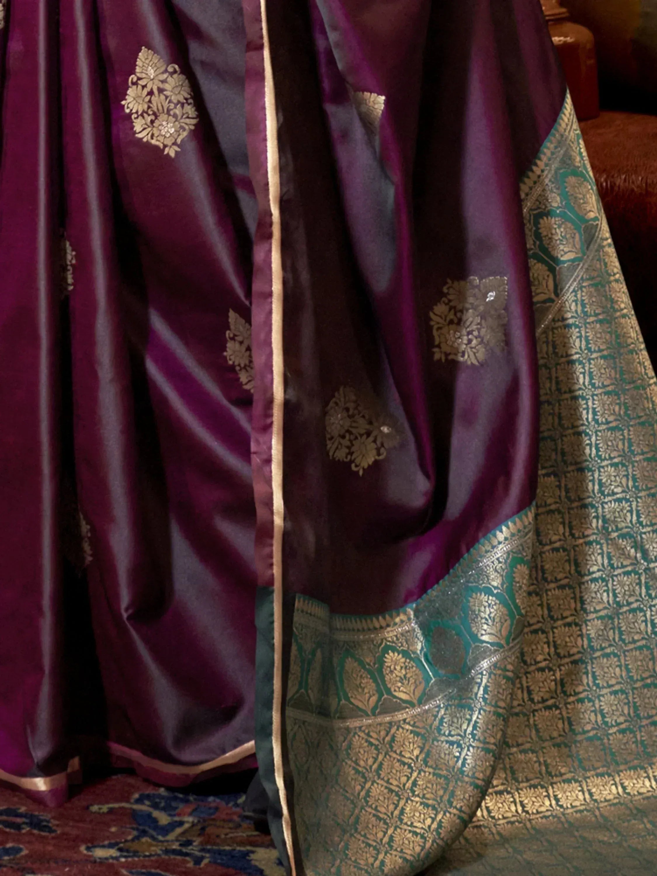 Luxury purple silk saree with gold floral embroidery and green border, perfect for Indian ethnic wear