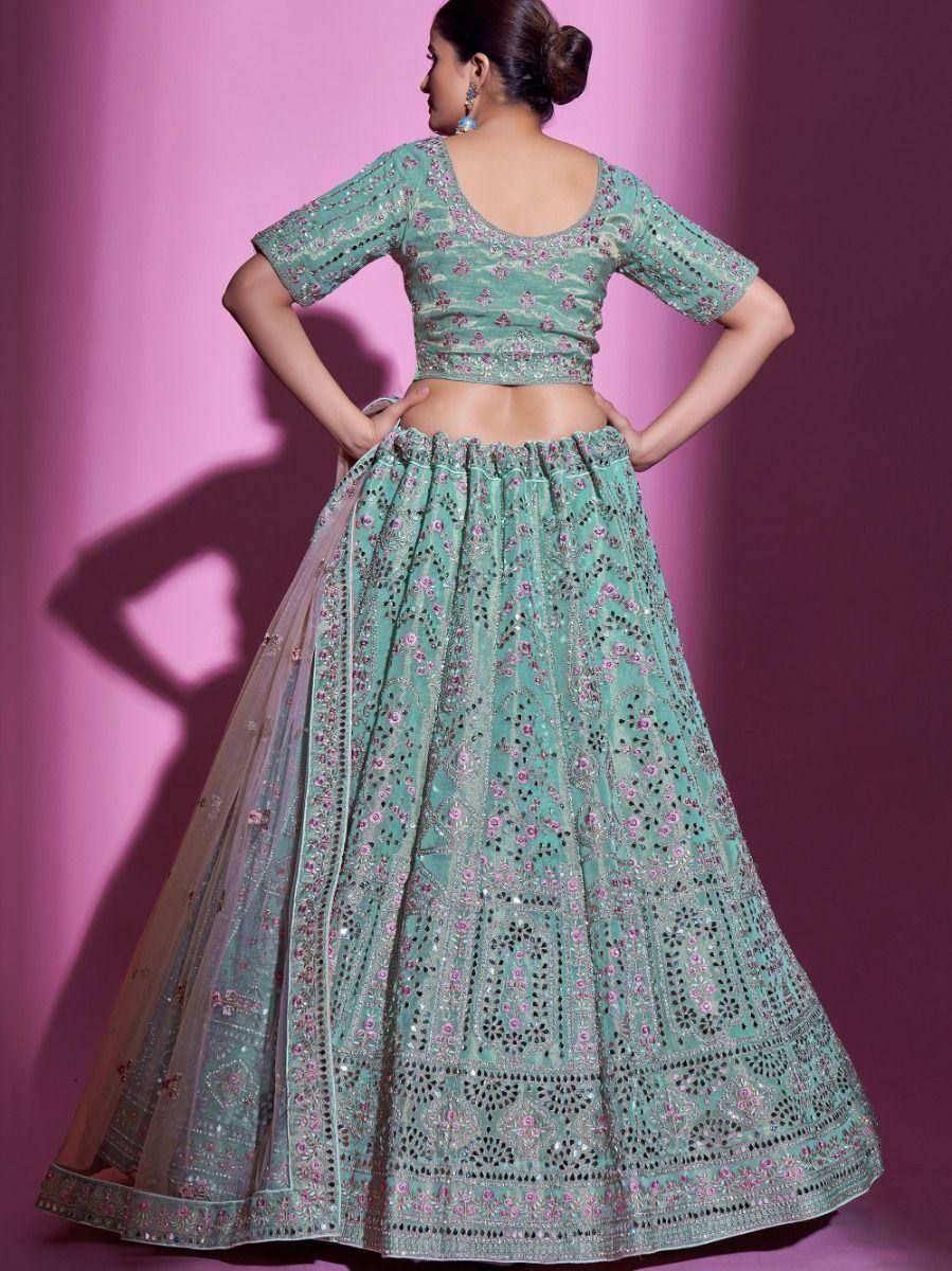 Mint green embroidered lehenga choli with floral motifs and mirror work, ideal for Indian ethnic occasions