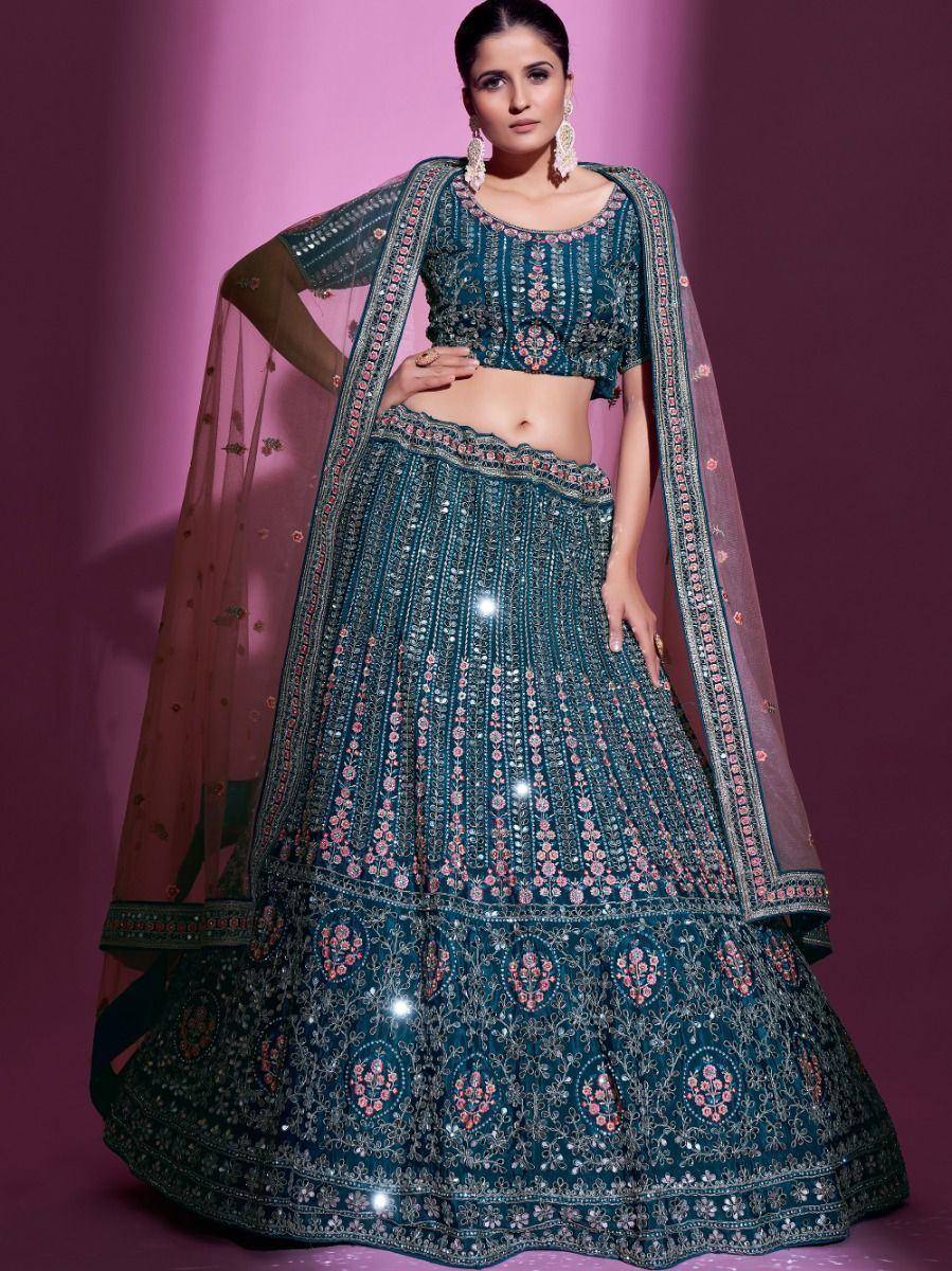 Teal embroidered lehenga choli with floral motifs and sheer dupatta, perfect for Indian ethnic wear