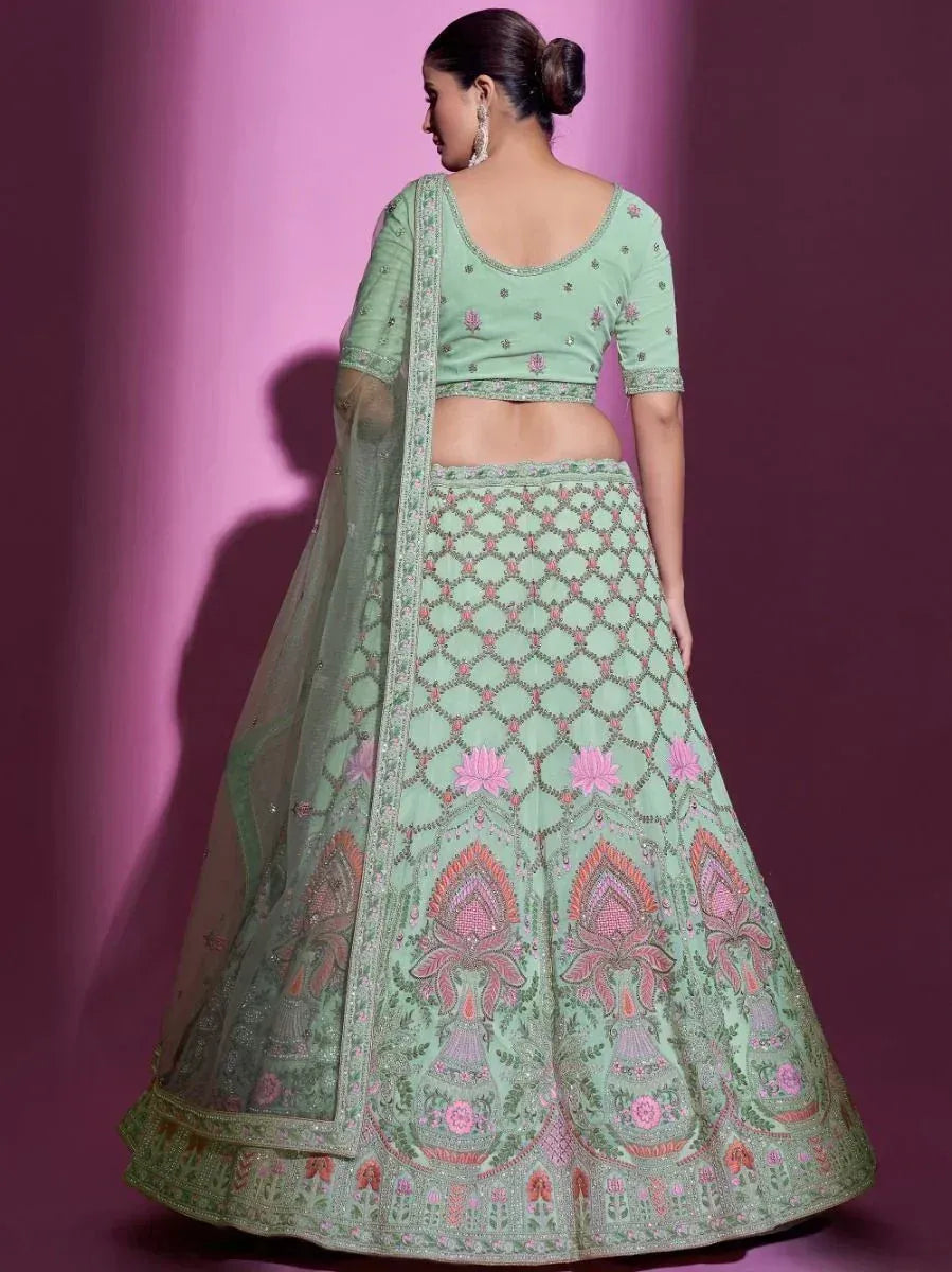 Mint green embroidered lehenga choli with floral motifs and sheer dupatta, perfect for Indian ethnic wear